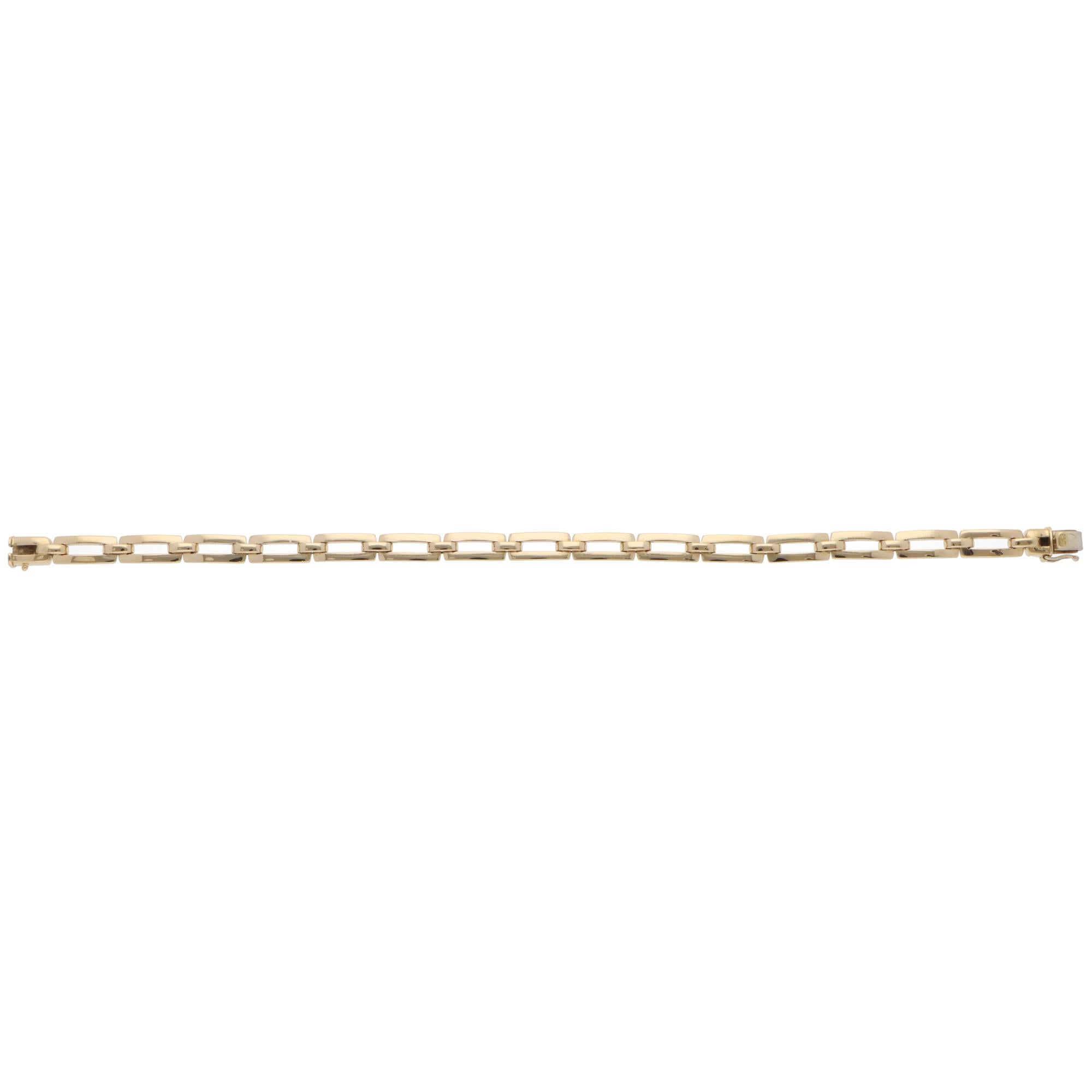 A beautiful vintage Cartier chain link bracelet set in 18k yellow gold from 1993.

From Cartier's discontinued collection, the bracelet is composed of solid yellow gold flat links that stand out beautifully on the wrist. The bracelet is secured with