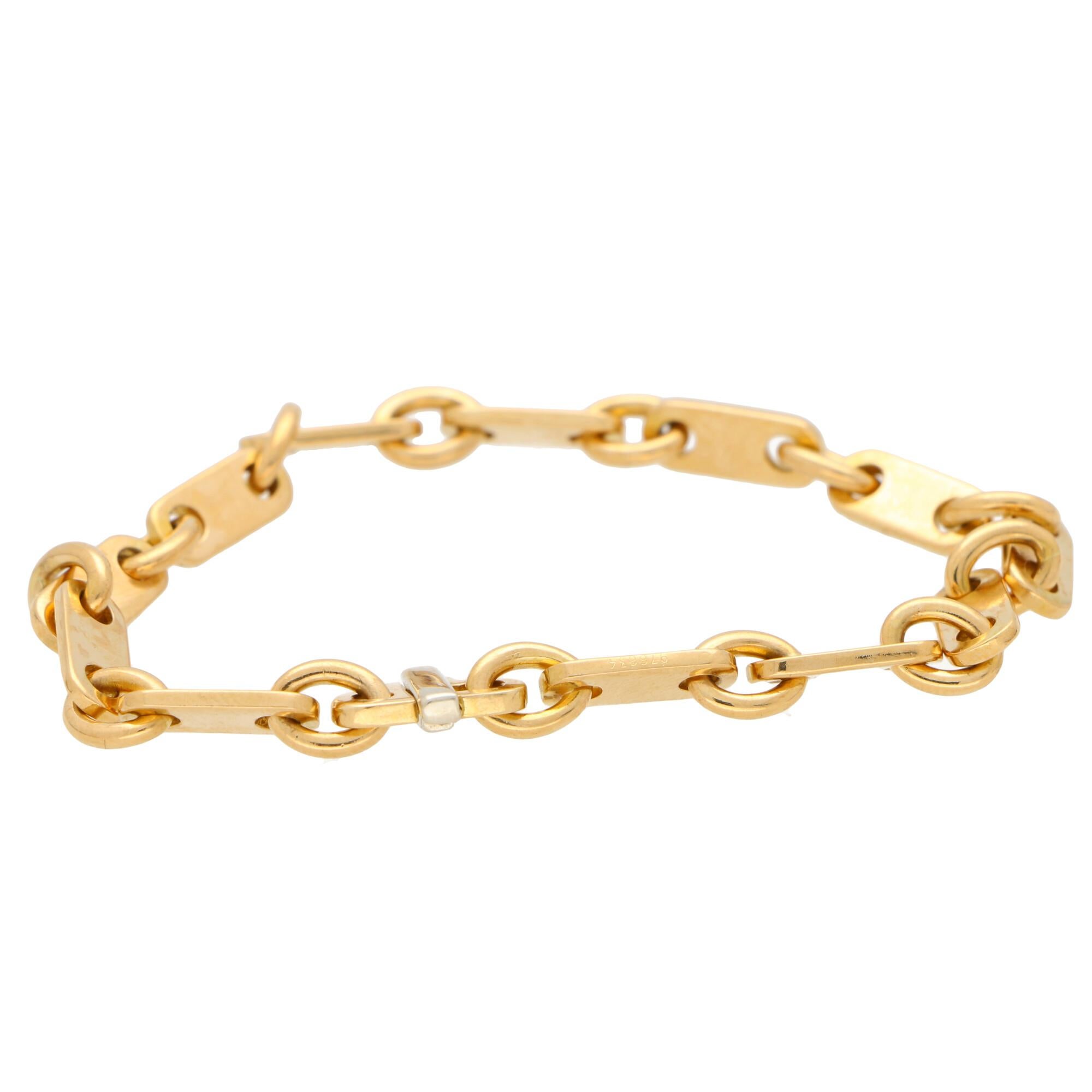A simple yet incredibly beautiful Cartier chain link bracelet made of solid 18k yellow gold.

The bracelet is composed of 12 rounded rectangular links and sits beautifully on the wrist. Due to the design of the bracelet it could easily be worn by