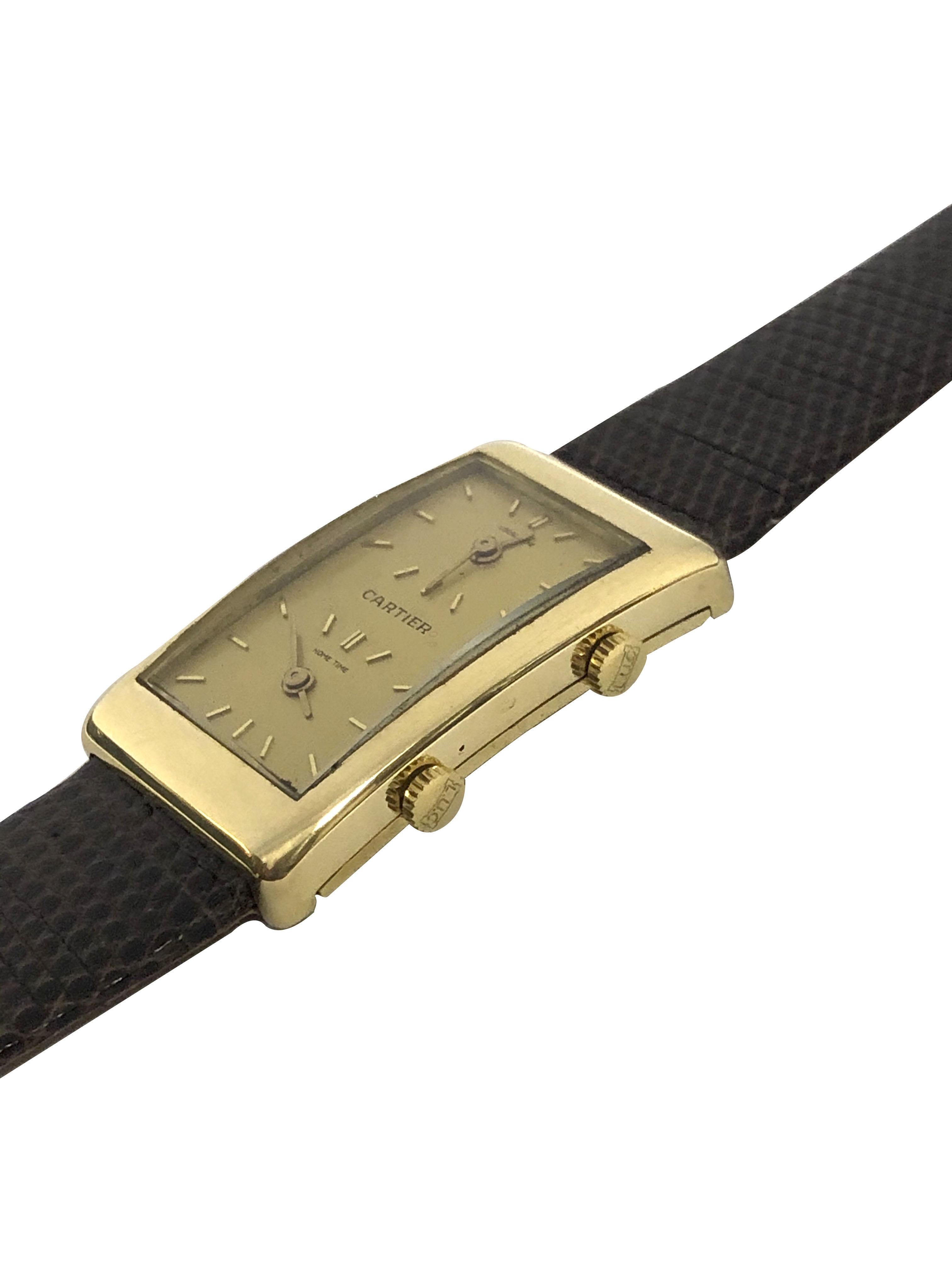 Circa 1970s L.U. Chopard for Cartier two Time Zone wrist watch, 36 X 22 M.M. 18K Yellow Gold 2 piece case. 2 independent 17 jewel Chopard Mechanical Manual wind movements, original Gold dial with raised Gold markers. New Brown Lizard strap with