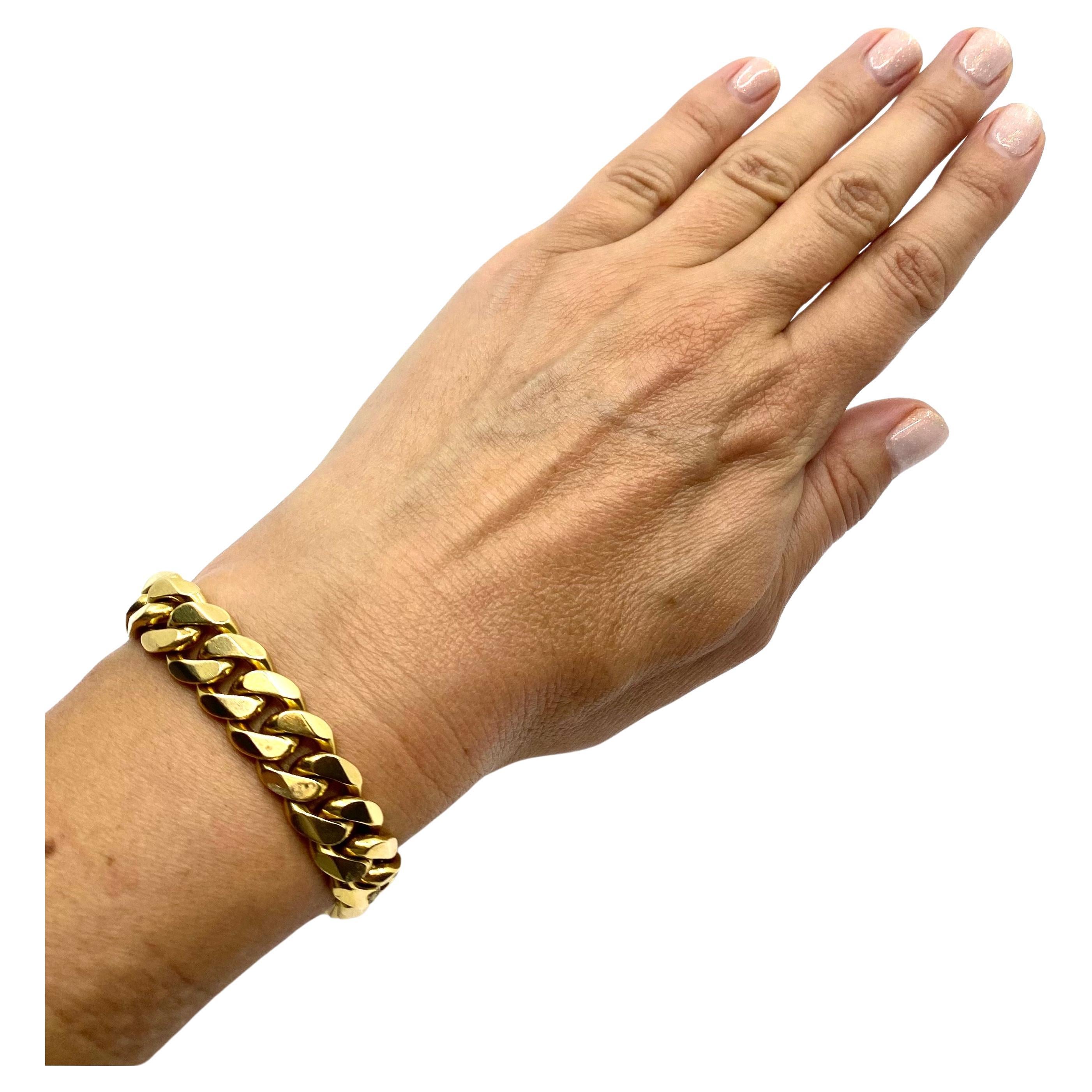 A great vintage Cartier gold bracelet crafted out of a curb link chain. A heavy and flat curb link chain makes a perfect bracelet on its own. But Cartier made a step up and added chamfered edges to the links. It appeared to be a perfect touch for