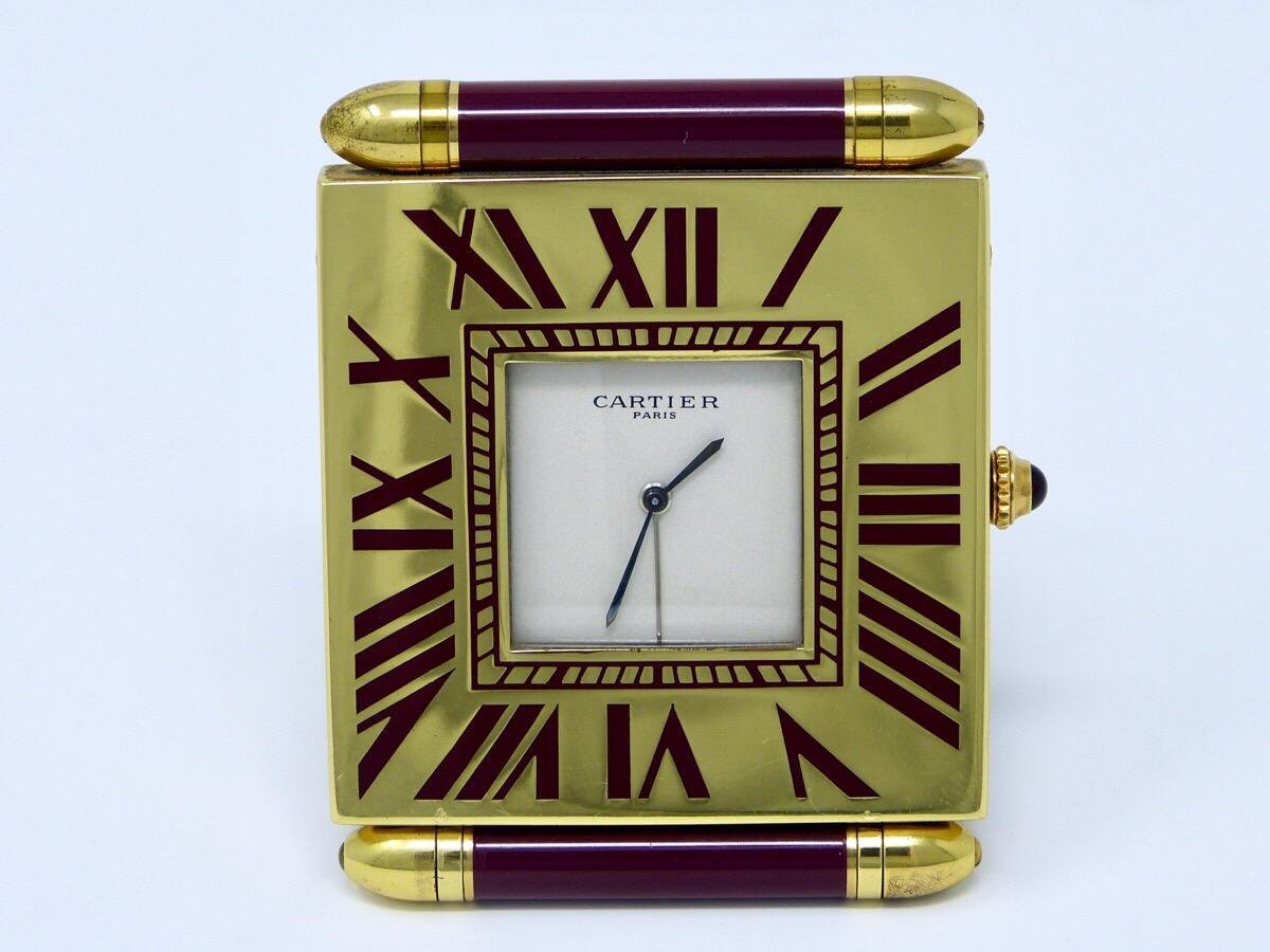 Vintage Cartier alarm table clock 
Excellent conditions and working fine
Comes with original box and leather pouch
Measurements: 63 x 55 x 55mm.