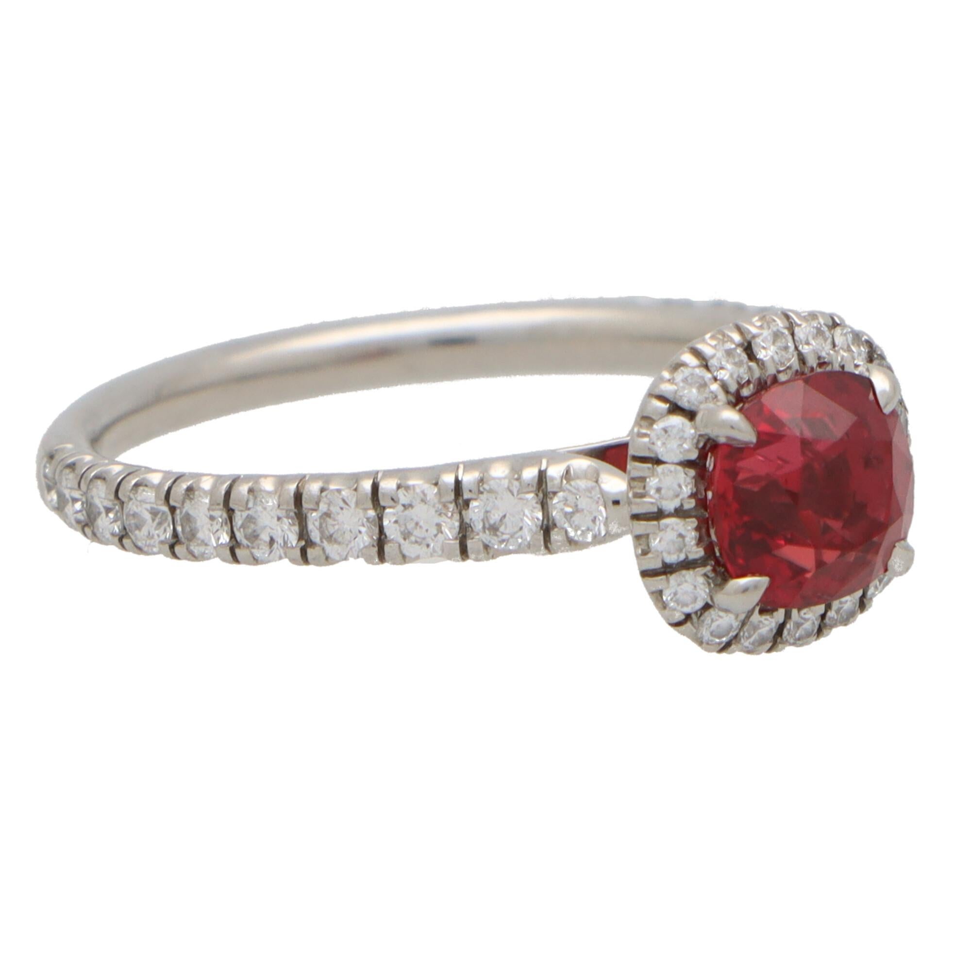 A beautiful vintage Cartier ruby and diamond halo ring set in platinum.

From the current ‘Destinée’ collection; the ring is predominantly set with a 1.05 carat cushion cut vibrant red ruby. This ruby is securely four claw set in an open back