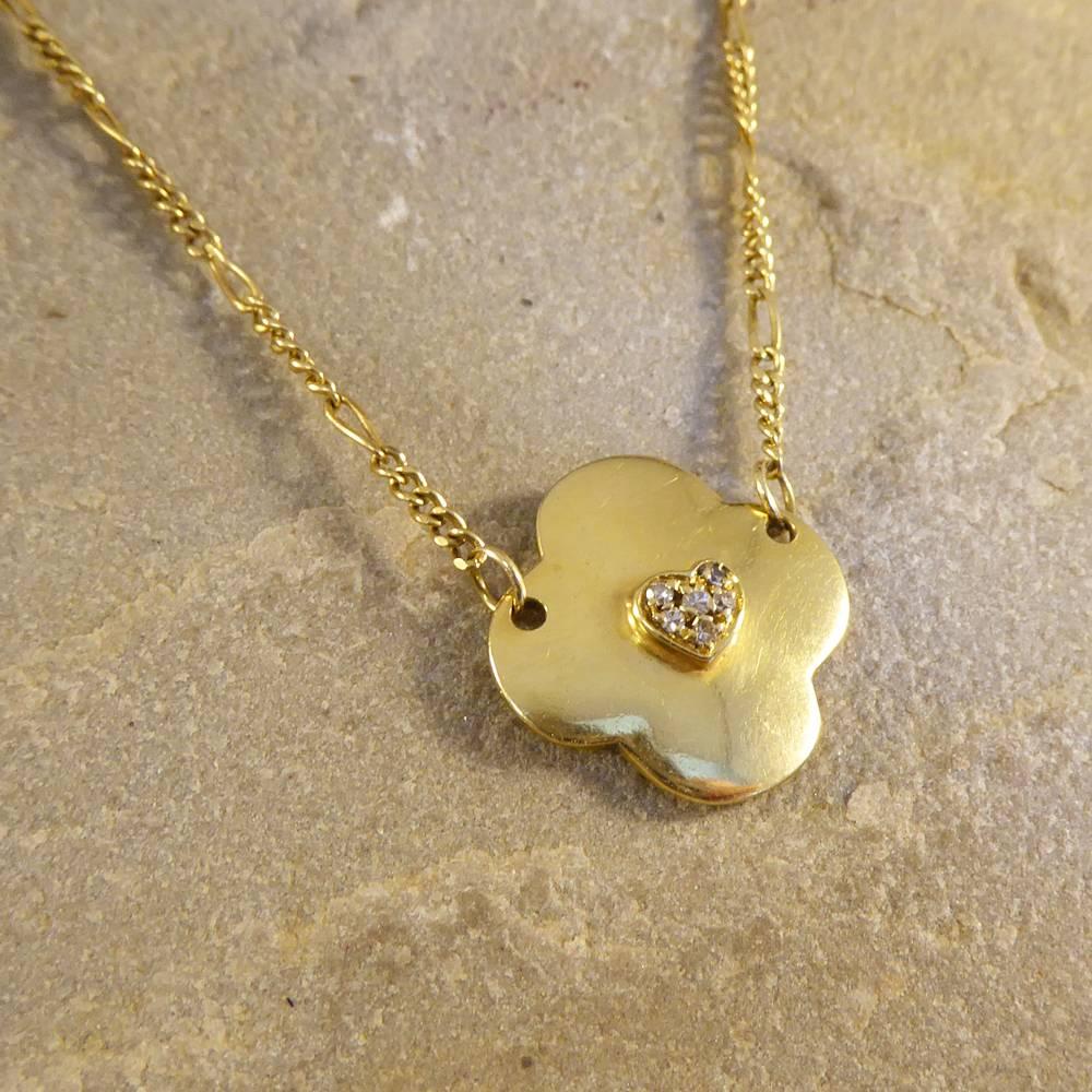 Measuring 18mm in height and width, this clover shaped pendant has a slight dome with a heat motif adorned with 6 small Diamonds. On the reverse shows clearly the Cartier mark. A gorgeous 18ct yellow Gold Cartier pendant and chain, the perfect gift