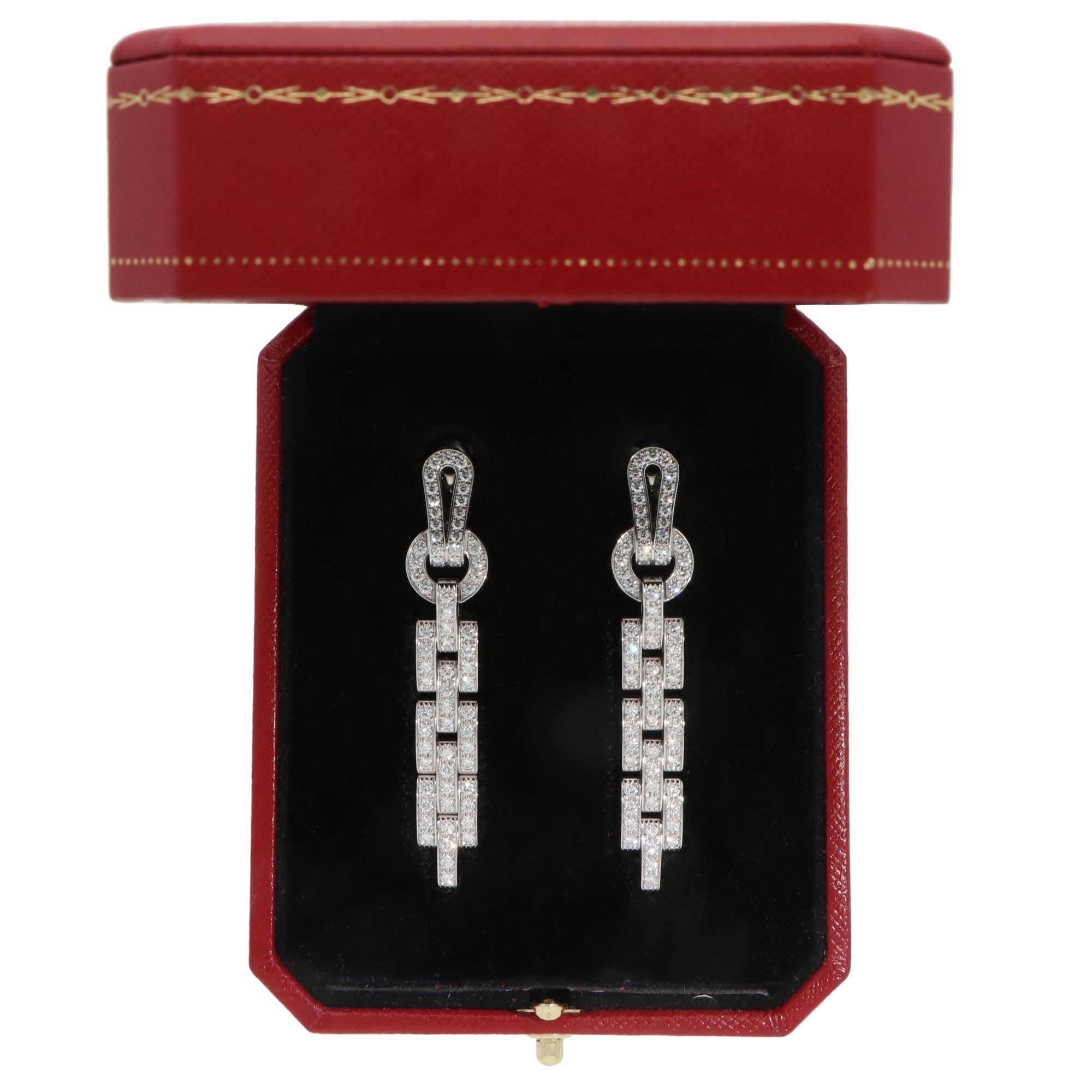 A beautiful pair of vintage Cartier ‘Agrafe’ drop earrings set in 18k white gold.

These gorgeous Cartier earrings from the classic Agrafe collection is crafted in 18k white gold. Each earing consists of the classic Cartier Agrafe design, each paved