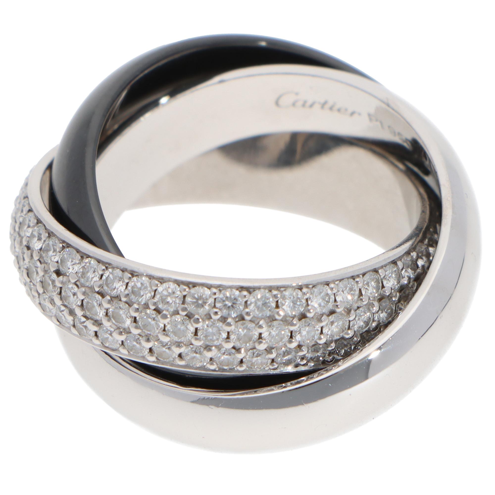 A classic vintage Cartier diamond and ceramic Trinity ring large model set in platinum.

The ring is composed of three 5-millimetre bands, which are soldered together to create the hoop. There are around 200 round brilliant-cut diamonds pavé set on