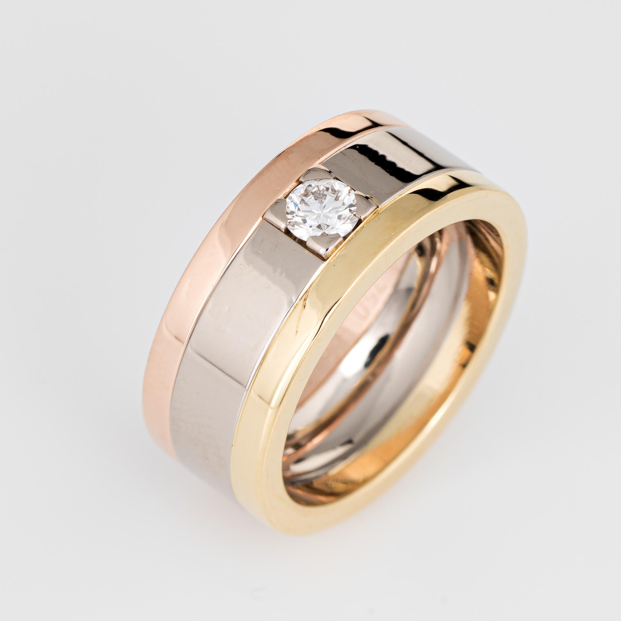 Pre owned vintage Cartier diamond ring crafted in 18 karat rose, yellow and white gold.  

The ring is set with an estimated 0.25 carat round brilliant cut diamond (estimated at F-G color and VVS2 clarity). 

The ring is in very good condition and