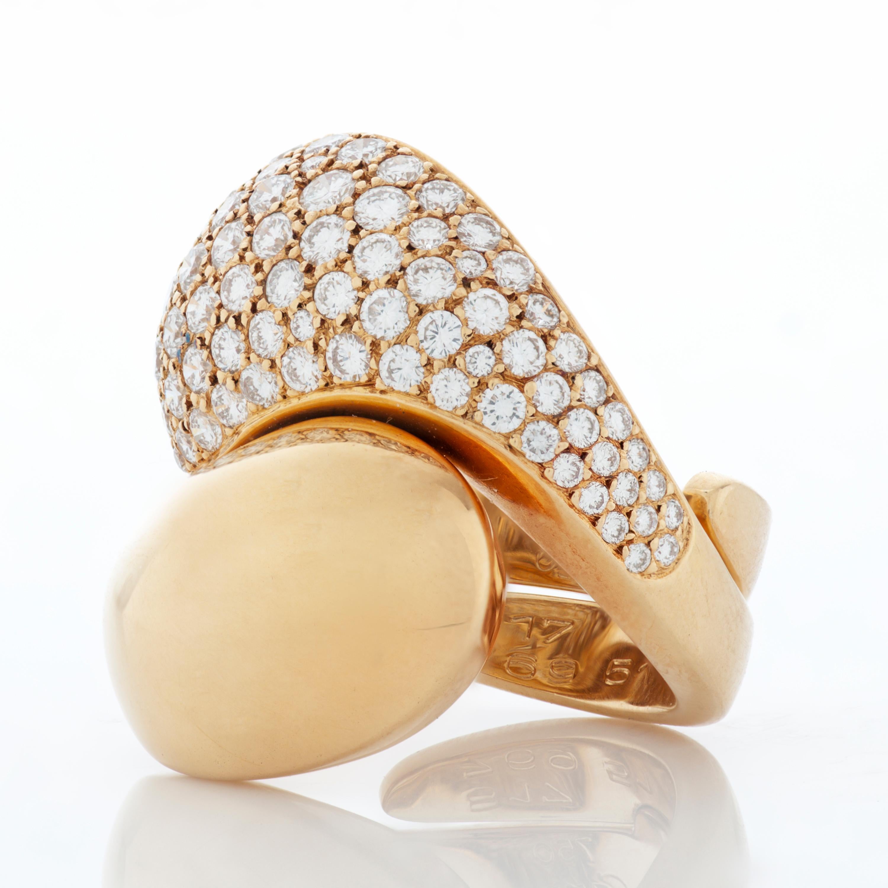 This vintage Cartier bypass ring features approximately 2.80 carat of round brilliant cut diamonds pave set in 18k yellow gold.  

The ring measures approximately 25mm (0.98