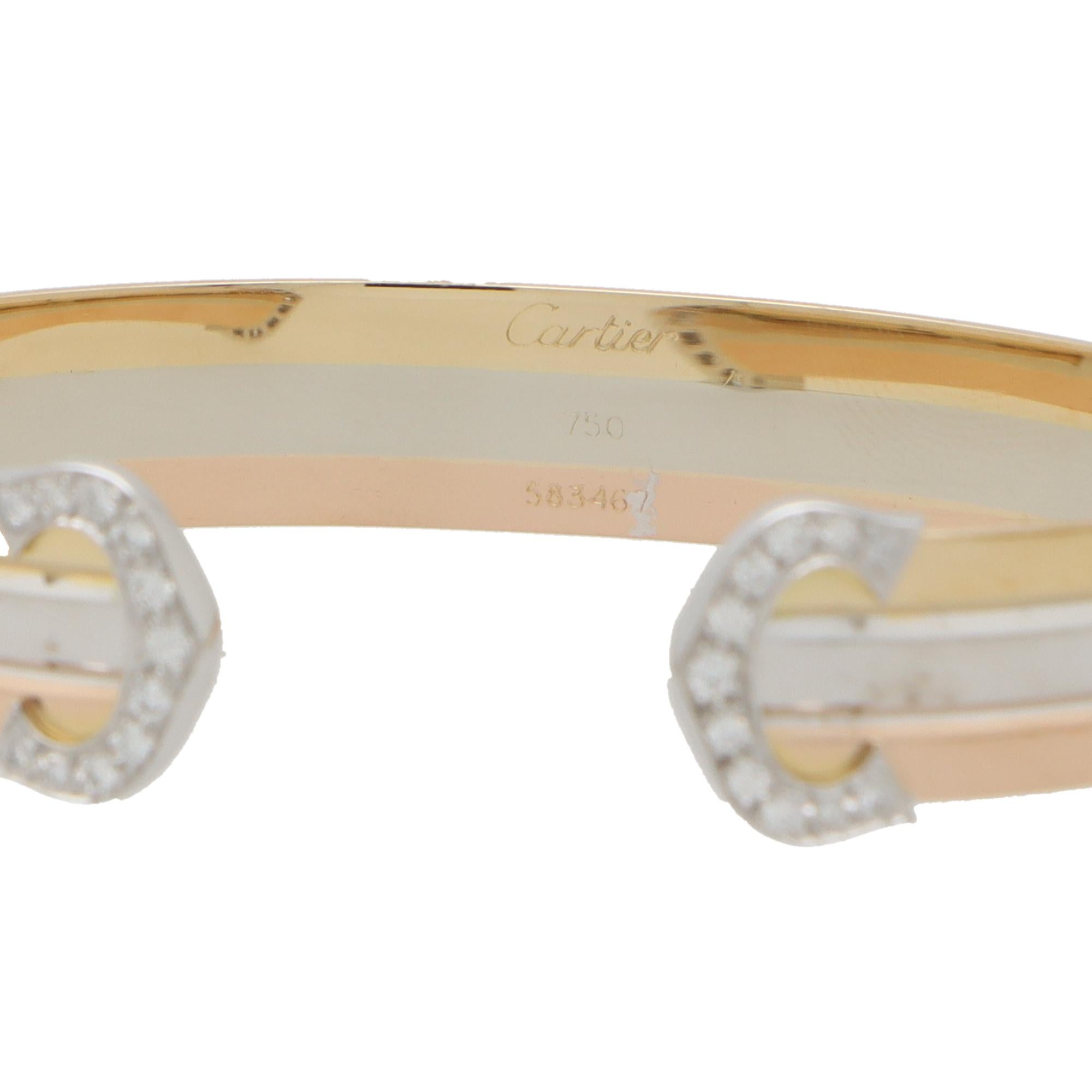 Round Cut Vintage Cartier Diamond Double C Bangle in 18k Rose, Yellow and White Gold