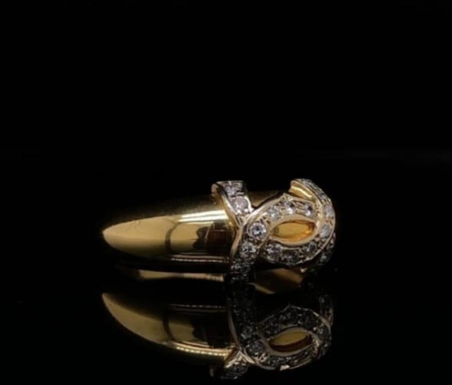 A vintage Cartier diamond logo ring 18 karat yellow gold, circa 1980.

This ring features the iconic interlocking Cartier double C's to its centre both grain set with round brilliant cut diamonds of 0.18 carat estimated as H colour, VS1