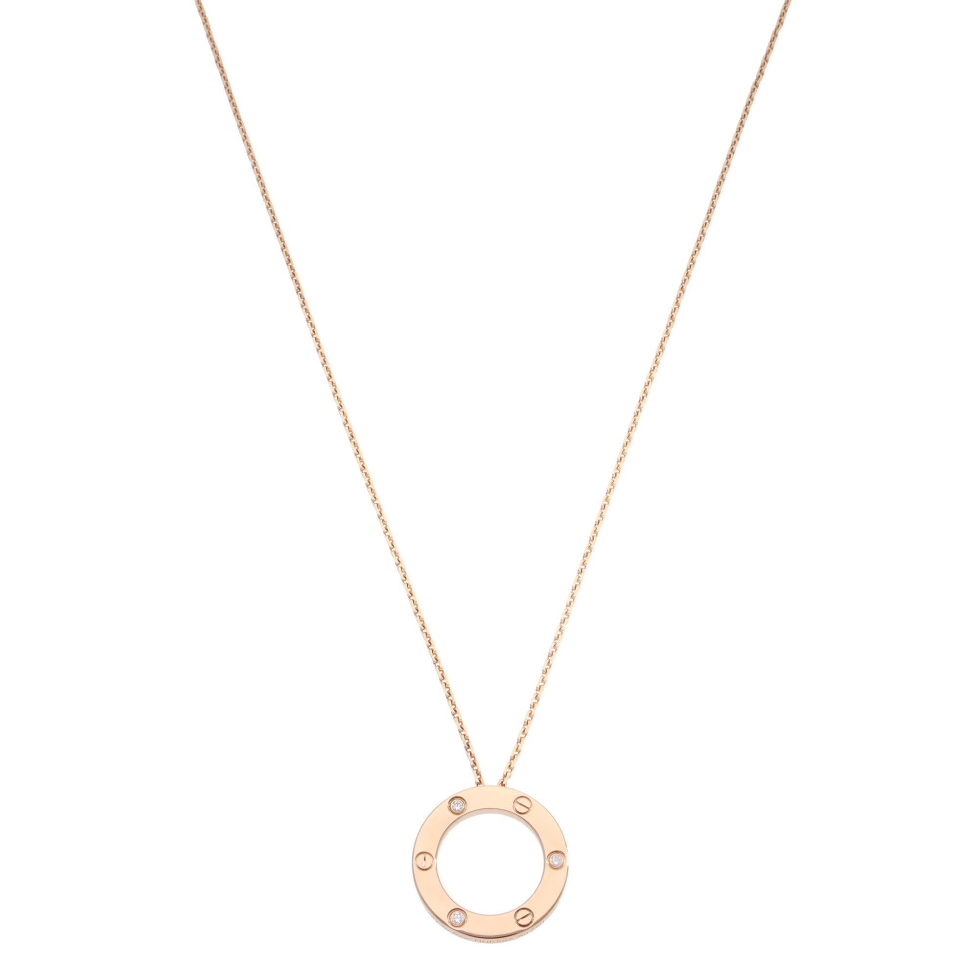 A classic vintage Cartier three-diamond LOVE pendant necklace set in 18k rose gold.

The LOVE collection is a firm favourite of many mainly due to the simple, beautiful and elegant design. The pendant is composed of a rose gold circle set throughout