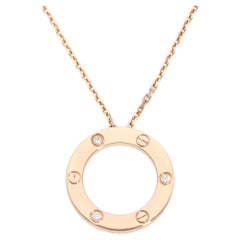 Cartier, collier pendentif LOVE vintage en or rose et diamants
