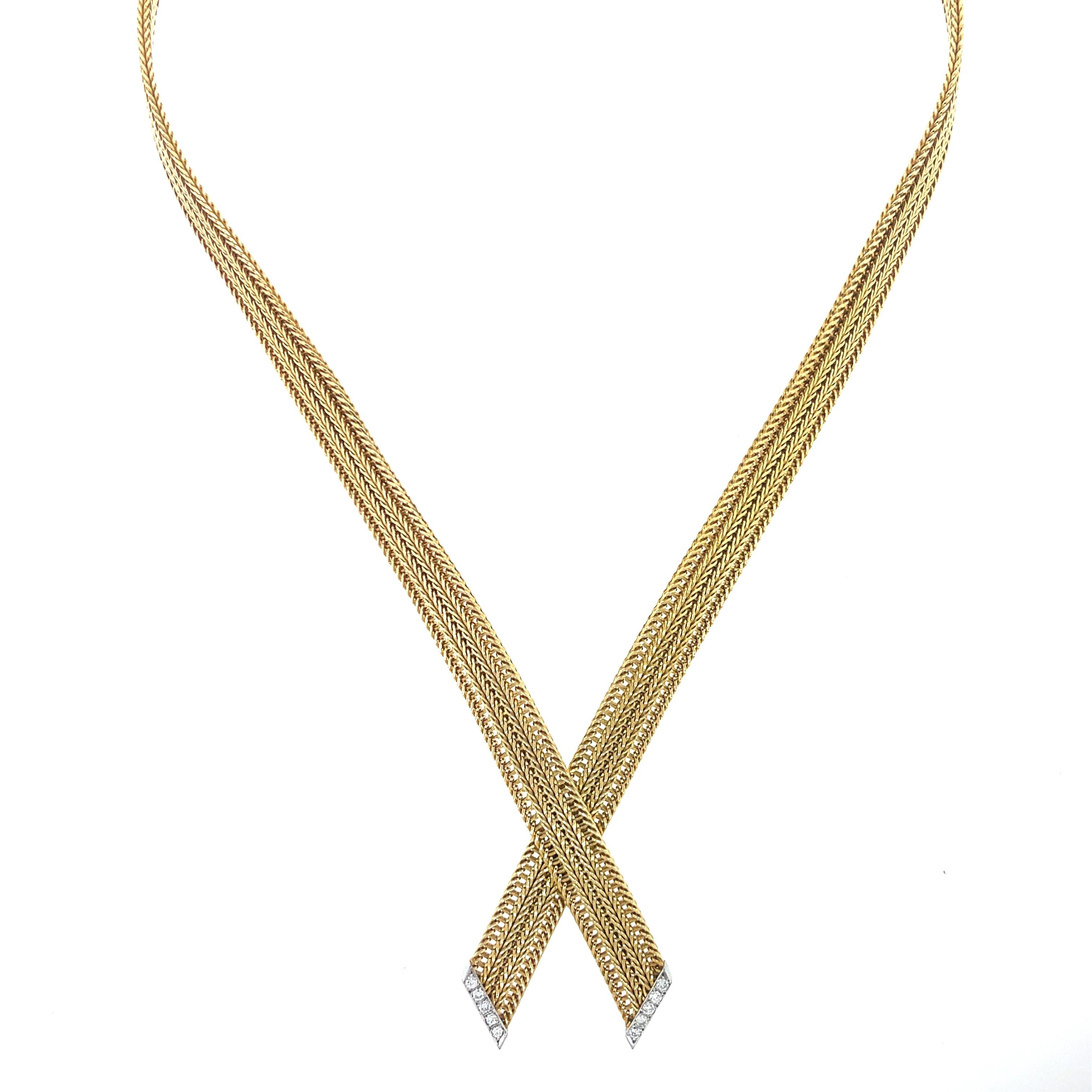 Vintage Cartier Diamond Necklace in 18K Yellow Gold. The necklace is accented by approximately 0.30ctw of brilliant round diamonds. Signed Cartier Germany. The necklace is 17