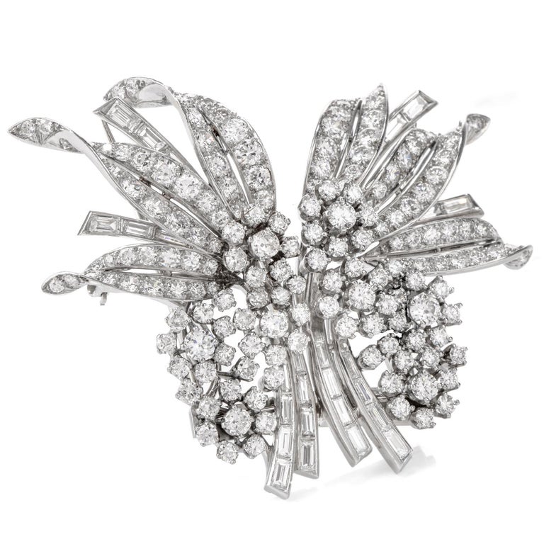 This exquisite Vintage Cartier double clip brooch pin was inspired in a 

Floral Motif and crafted in Luxurious Palladium.

Each side of the brooch mirrors the other with a floral grouping with leaves.

  Both round and baguette cut diamonds adorn