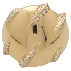 Bague Vintage Cartier en or jaune 18k avec diamant ''Panther Claw''.