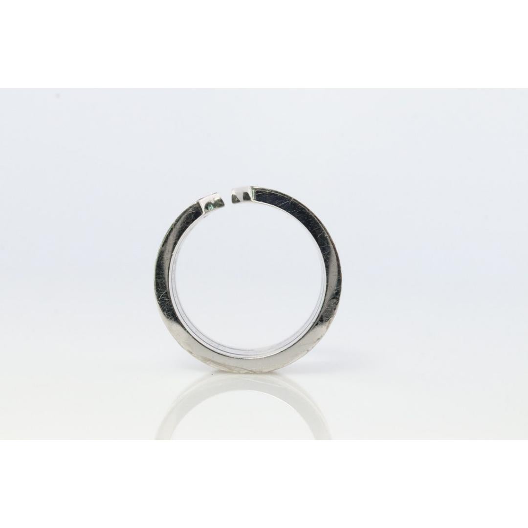 Vintage from the 1990s
Size: 4 1/2 US
Materials: Gold, Platinum
Gemstone: Diamond
Gem color: Colorless

Band color: Yellow

CARTIER 18k 750 White Gold Diamond ring

Open C Diamond Band Collection

Condition: Has not been polished. Has minimal