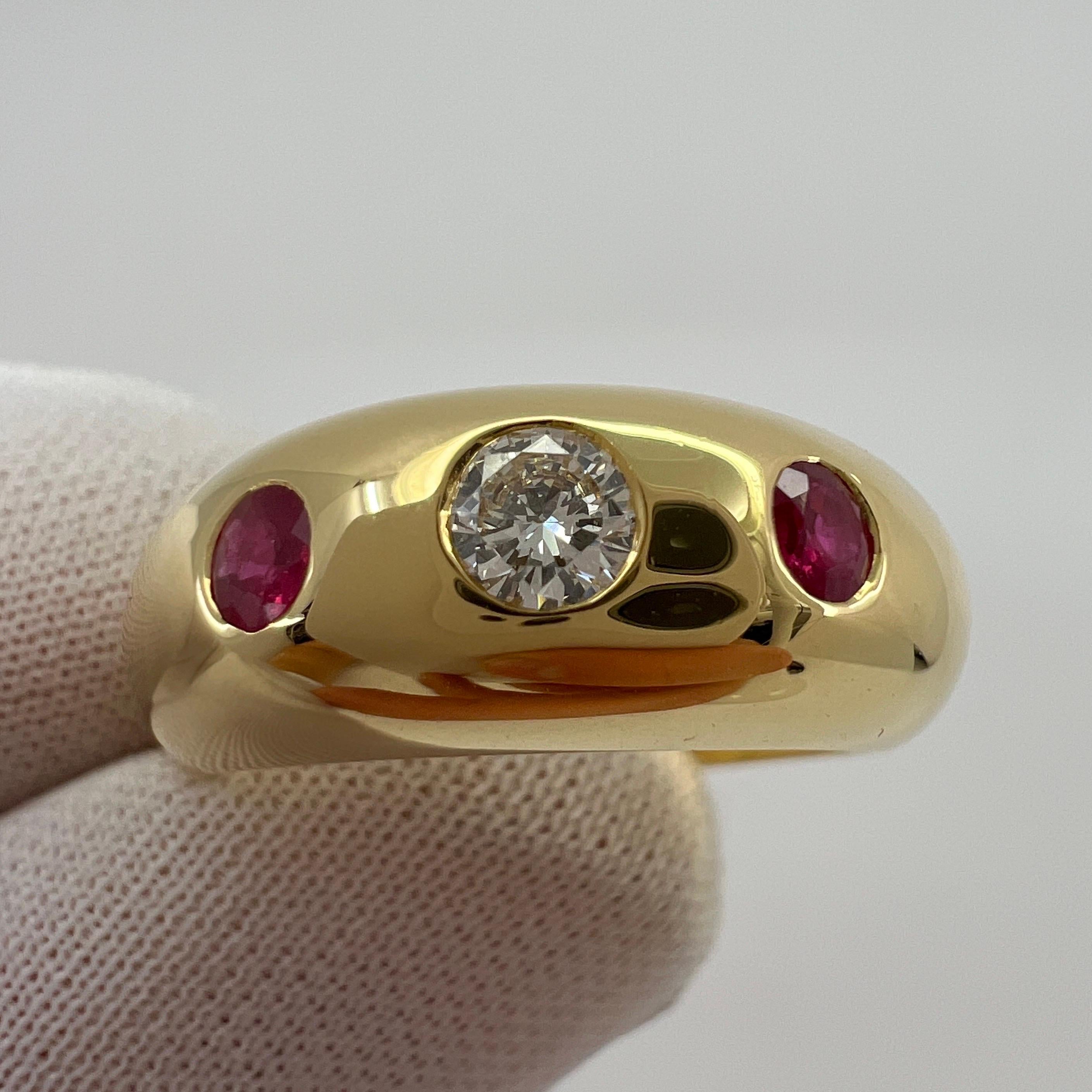 Rare Vintage Cartier Diamond & Ruby 18k Yellow Gold Three Stone Daphne Ring.

Stunning yellow gold Cartier ring set with a beautiful 4mm centre diamond with F/G Colour and VVS clarity. This is accented by 2 fine deep red rubies approx. 3mm