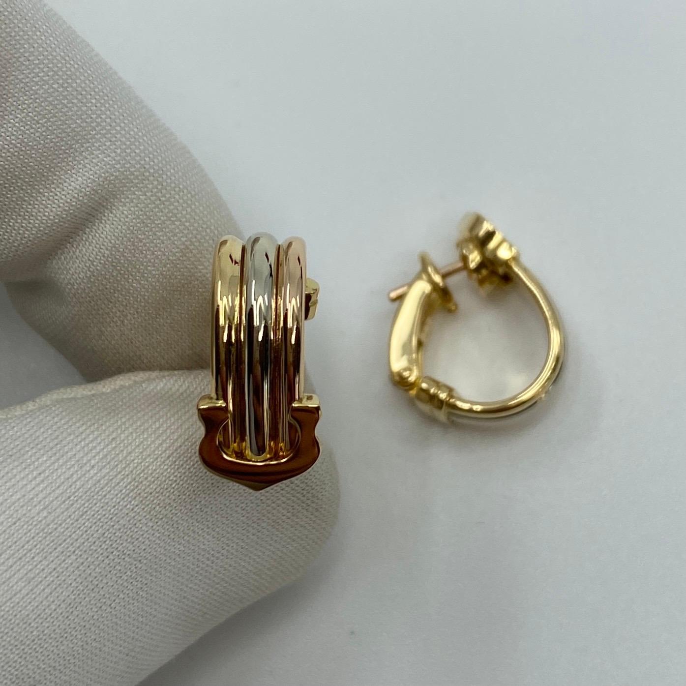 Vintage Cartier Double C 18k Multi Tone Gold Hoop Earrings.

Beautiful earrings featuring multi tone gold bands (yellow, white and rose gold) and the iconic Cartier C's. 
Fitted with secure and comfortable clip-on over post fastening.

Each earring