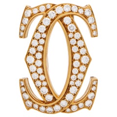 Spilla vintage con diamanti con motivo a doppia C di Cartier in oro giallo 18 carati