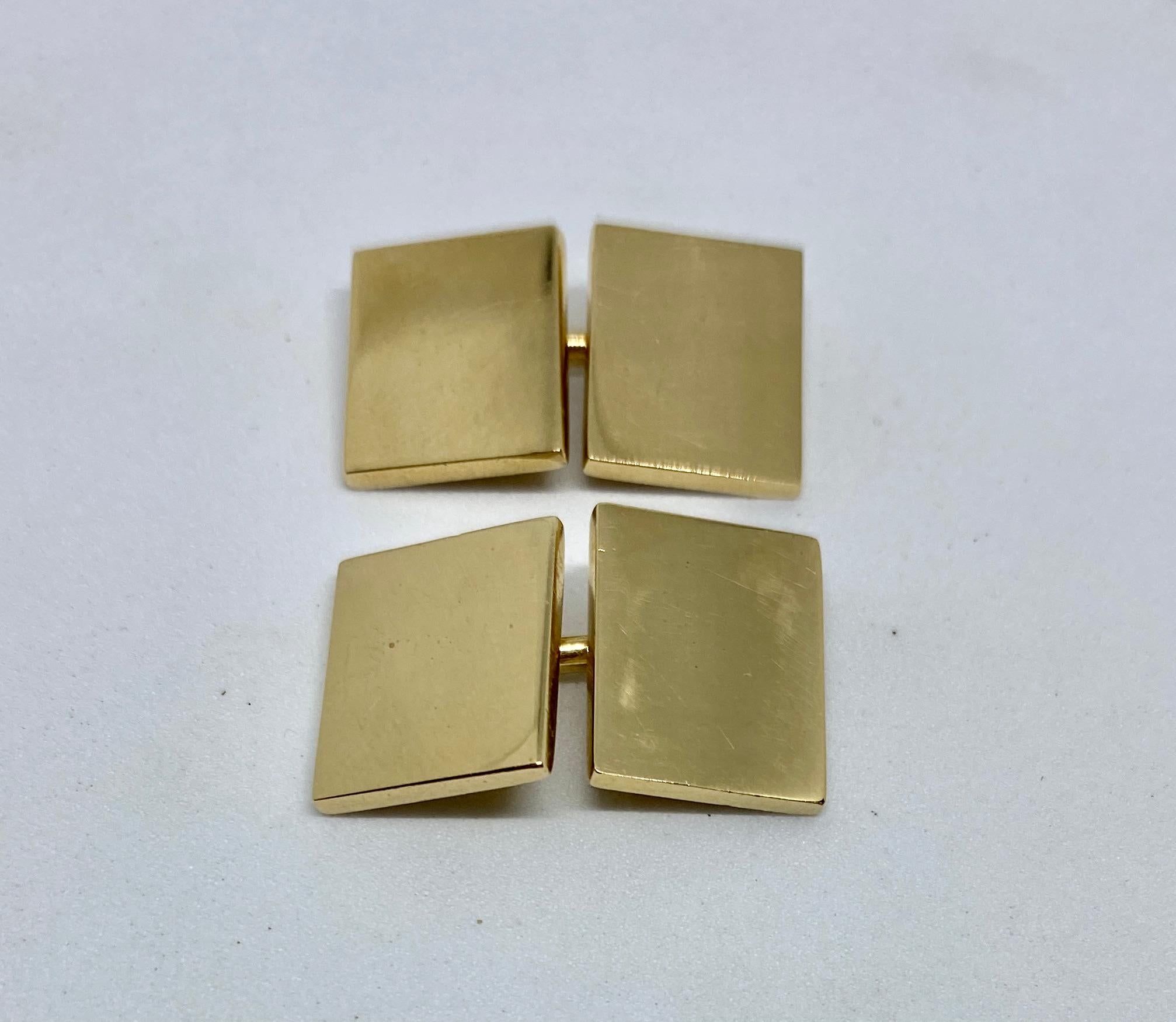 Extremely unusual double-sided rectangular cufflinks in solid yellow gold by Cartier.

As is to be expected, the cufflinks are extremely well made, weighing more than 20 grams. The four cufflinks faces each measure 12.6 by 16mm. The gold is thick