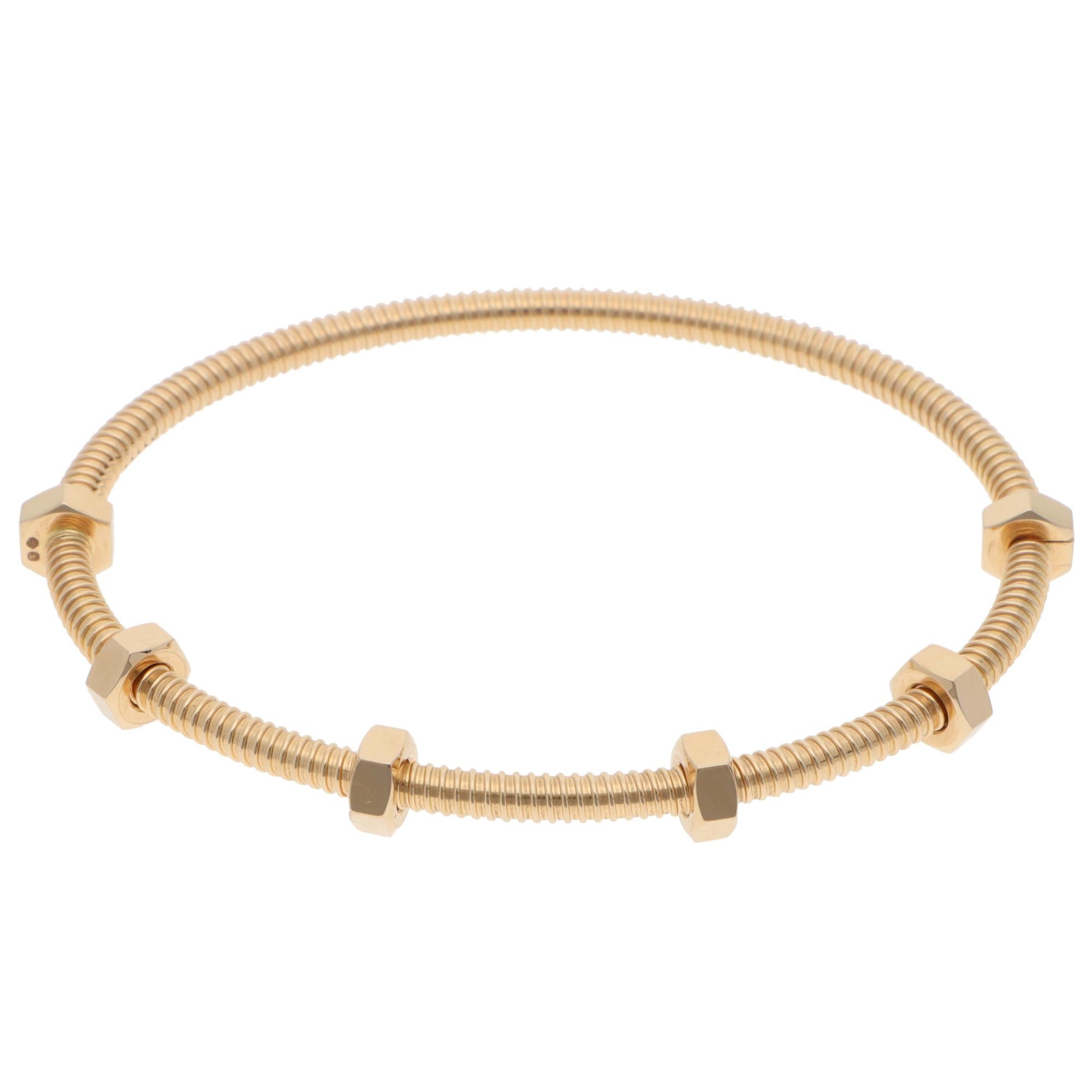 A classic vintage Cartier Ecrou de Cartier bracelet set in 18k yellow gold.

The bracelet is from the current Ecrou de Cartier collection, one of the most recognisable pieces of Cartier jewellery. The bracelet is in the iconic Cartier nail motif and