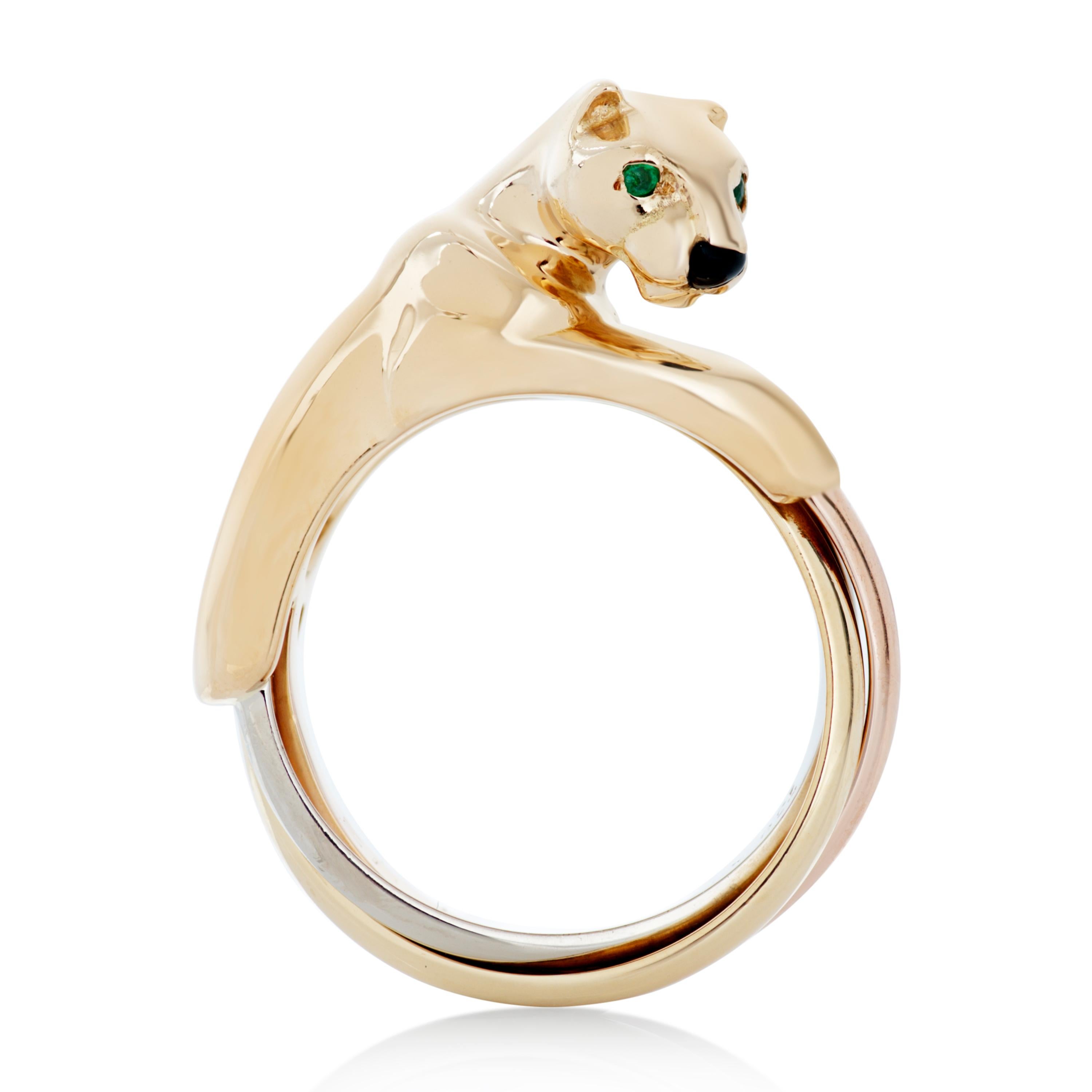 Vintage Cartier panther trinity ring in 18k yellow, rose and white gold.

This Cartier ring features an 18k yellow gold panther with emerald eyes and an onyx nose.  The panther is seated on intertwined bands of 18k yellow, white and rose gold.

Size