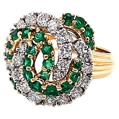 Cartier, bague tourbillon vintage en or jaune 18 carats avec émeraudes et diamants
