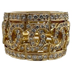 Cartier, bague à large anneau vintage en or 18 carats et diamants entrelacés