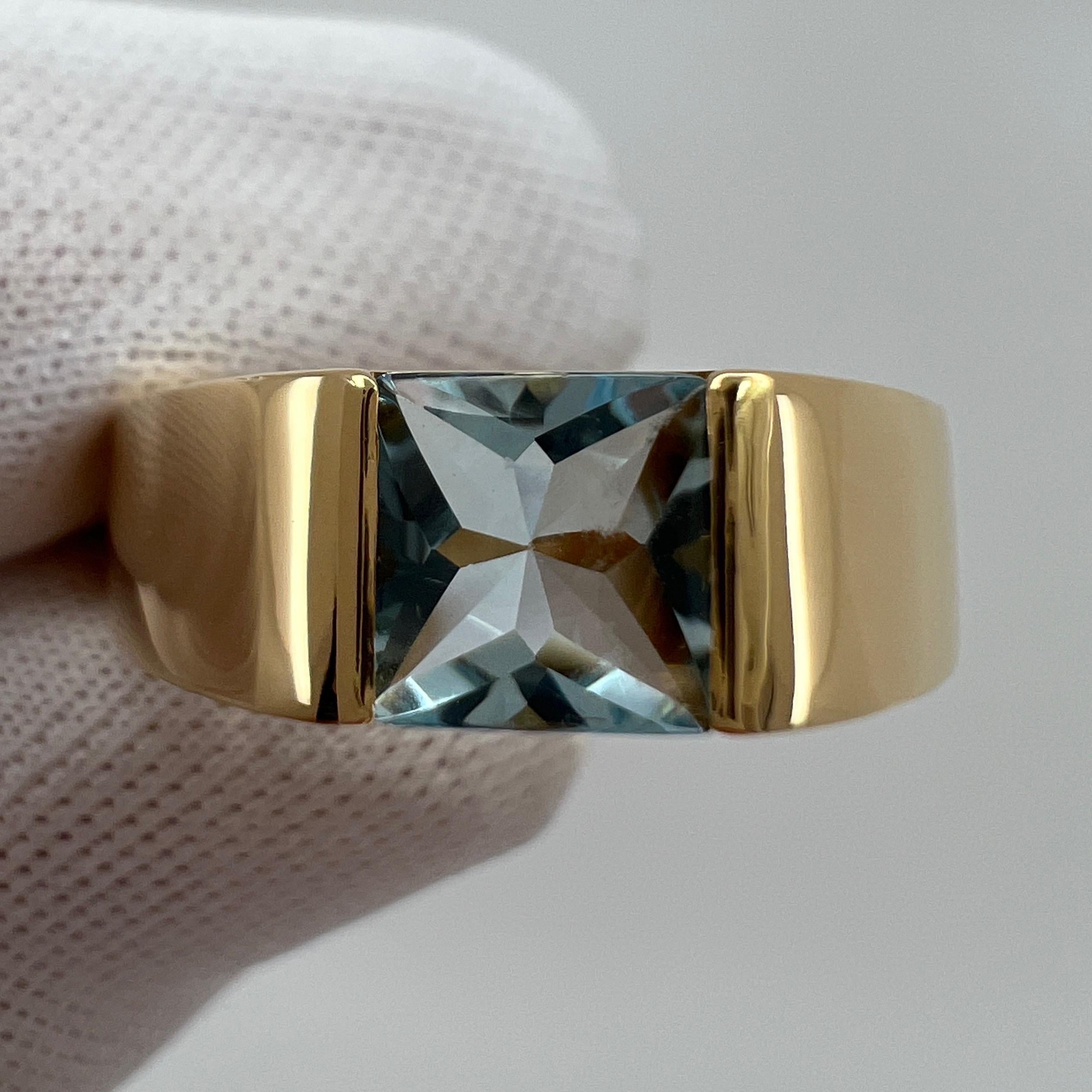 Vintage Cartier Fine Blue Aquamarine 18 Karat Yellow Gold Tank Ring.

Stunning yellow gold ring with a 6mm tension set fine blue aquamarine. 
Fine jewellery houses like Cartier only use the finest of gemstones and this aquamarine is no exception. A