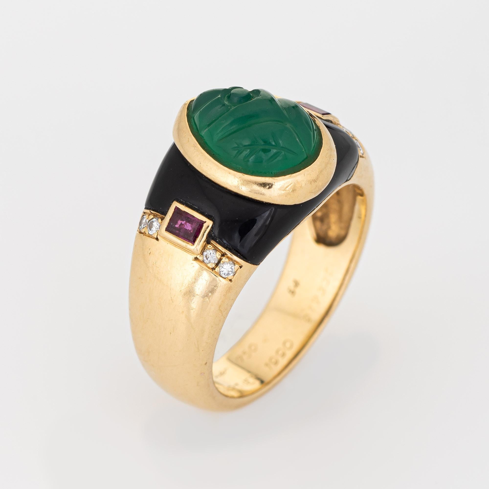 Stylish vintage Cariter Mughal ring crafted in 18 karat yellow gold (circa 1990). 

Carved chrysoprase measures 10mm x 7mm, accented with two estimated 0.10 carat rubies and eight estimated 0.01 carat diamonds (estimated at F-G color and VVS2