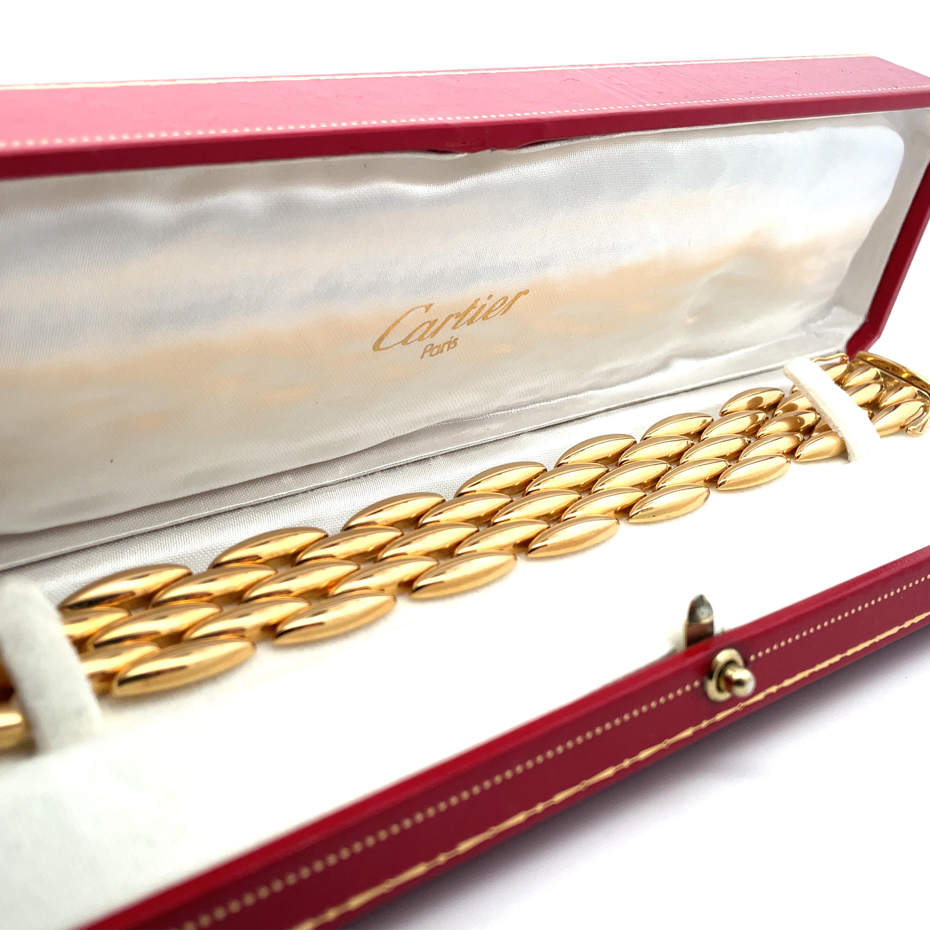 Cartier yellow five row bracelet, circa 1990
A rare retro bracelet from Cartier's elegant Gentiane collection.
The bracelet is comprised of five rows each segment designed as an elongated lozenge shape crafted in 18 karat yellow gold with a fine