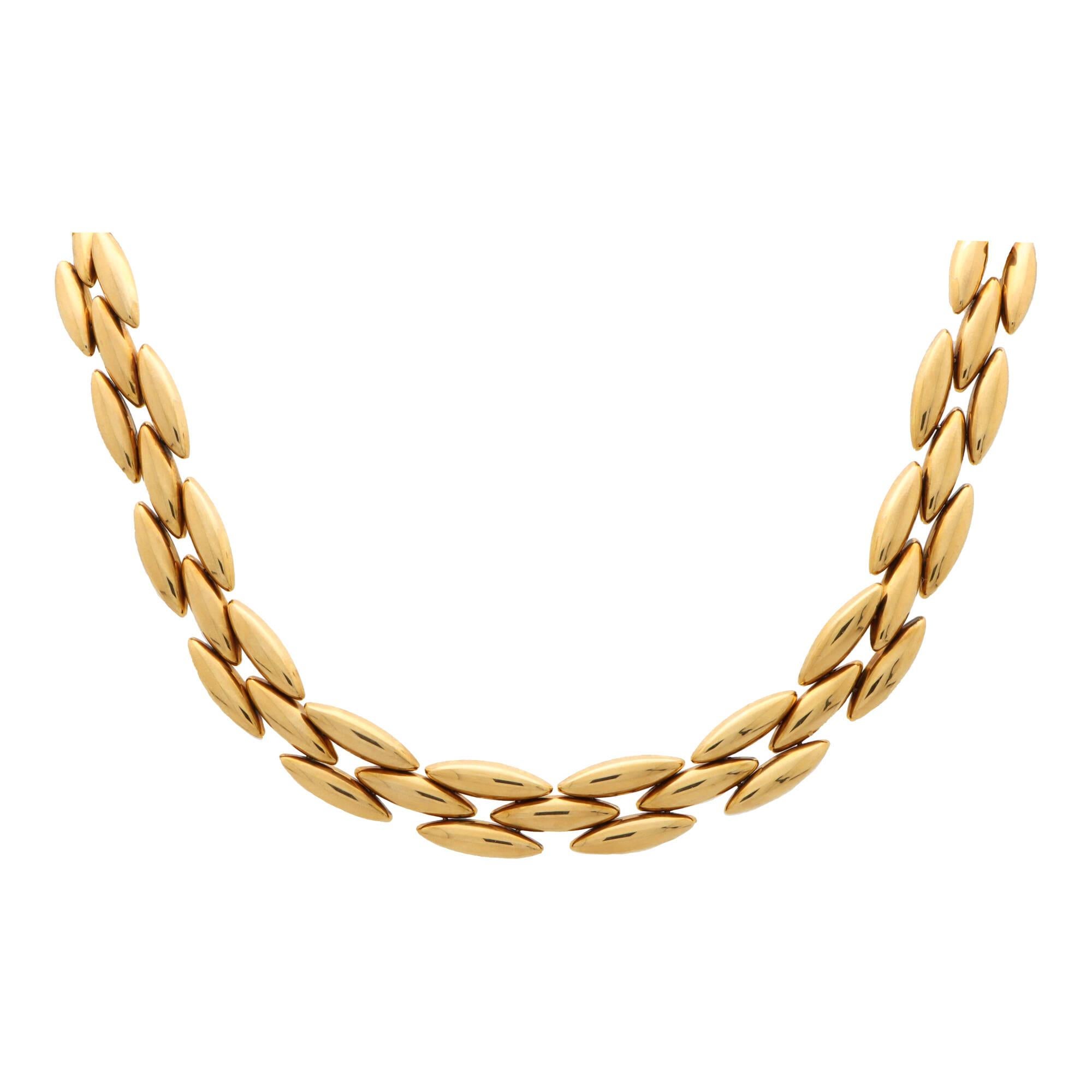A vintage Cartier ‘Gentiane’ oval link necklace set in 18k yellow gold.

Form the discontinued 1990’s ‘Gentiane’ collection, the necklace is composed of a 60 individual pointed oval links; all of which are articulated to move freely on the neck. The