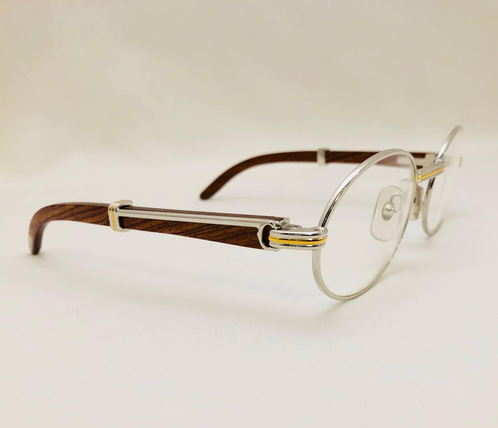 Cartier crafted the ultimate pair of glasses out of 18K Gold and Rosewood.  Known as 