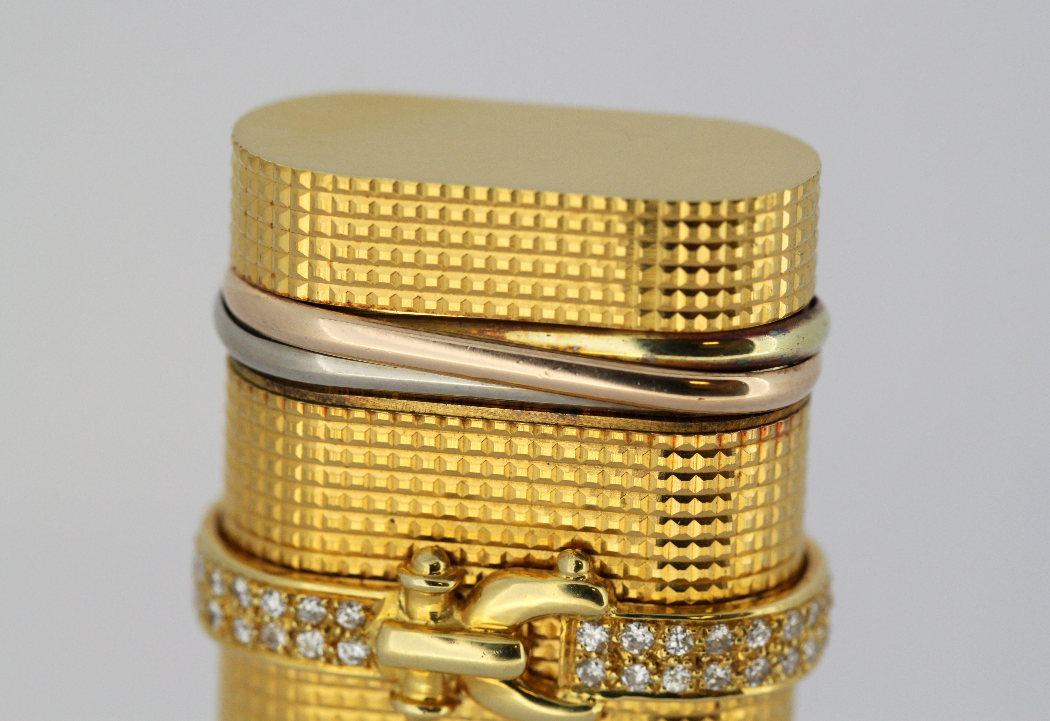 Vieux briquet Cartier plaqué or avec diamants 1