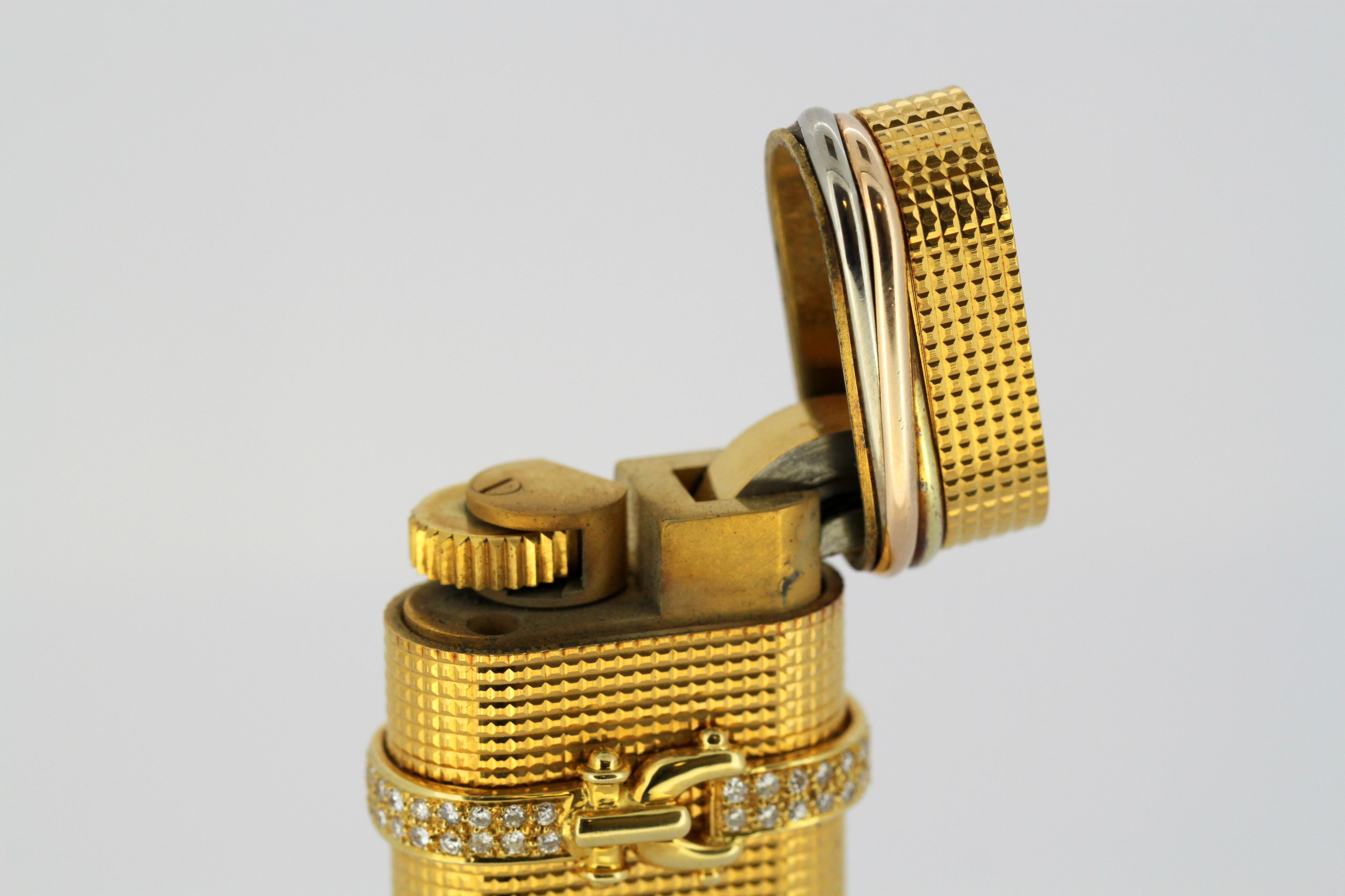 Vieux briquet Cartier plaqué or avec diamants 2