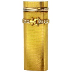 Vieux briquet Cartier plaqué or avec diamants