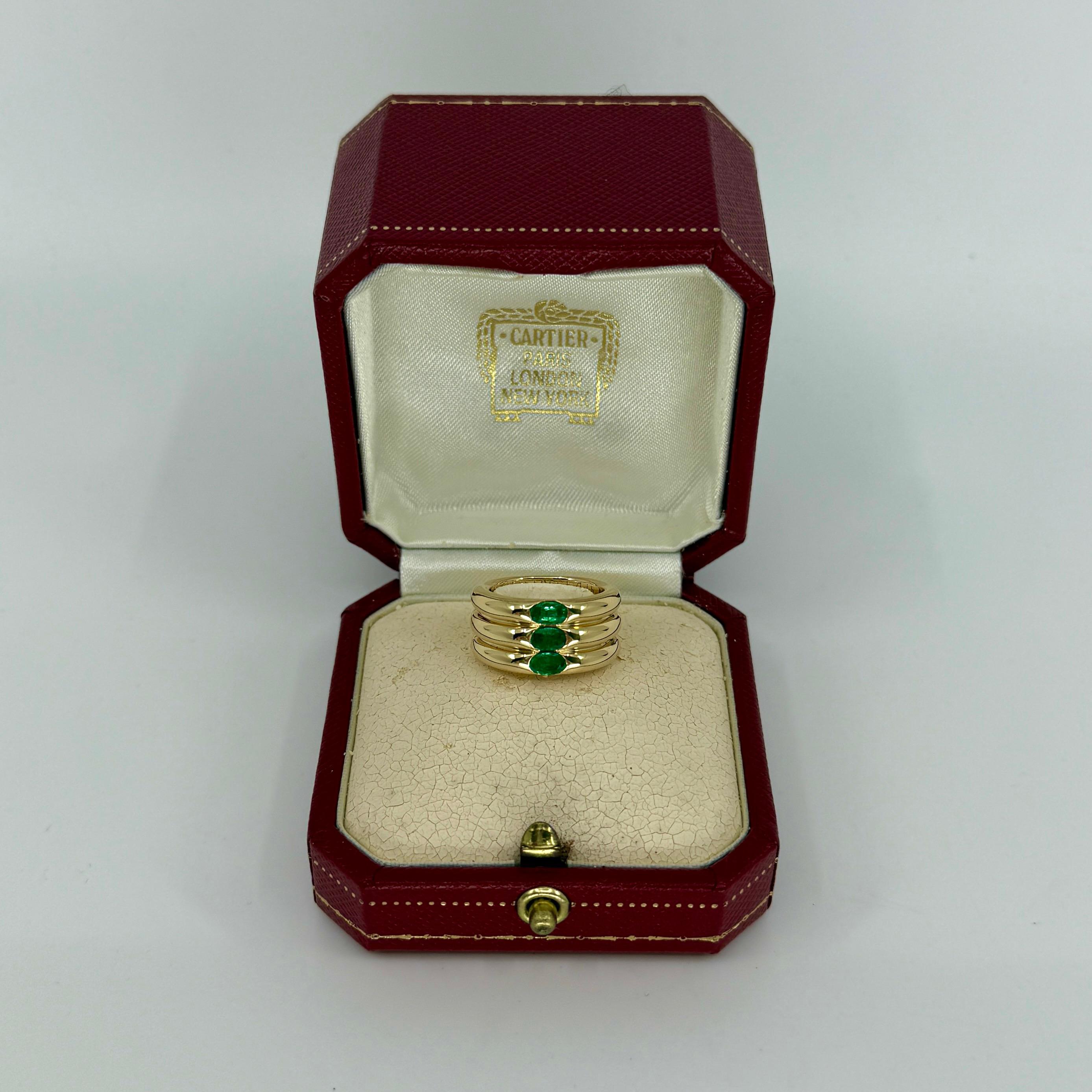 Rare Vintage Cartier Vivid Green Emerald 18k Yellow Gold Three Stone Band Ring.

Stunning yellow gold Cartier ring set with a three fine vivid green emeralds. Fine jewellery houses like Cartier only use the finest of gemstones and these emeralds are