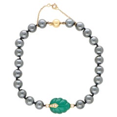 Bracciale vintage Cartier con ematite, calcedonio e diamanti in oro giallo 18 carati