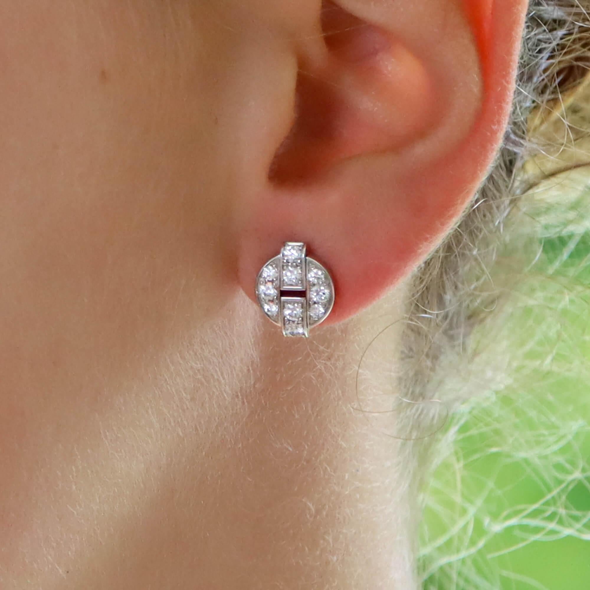 A beautiful vintage pair of Cartier Himalia diamond stud earrings set in 18k white gold.

Each earring depicts a circle motif and are set with exactly 10 round brilliant cut diamonds. They are secured to reverse with a post and butterfly fitting.