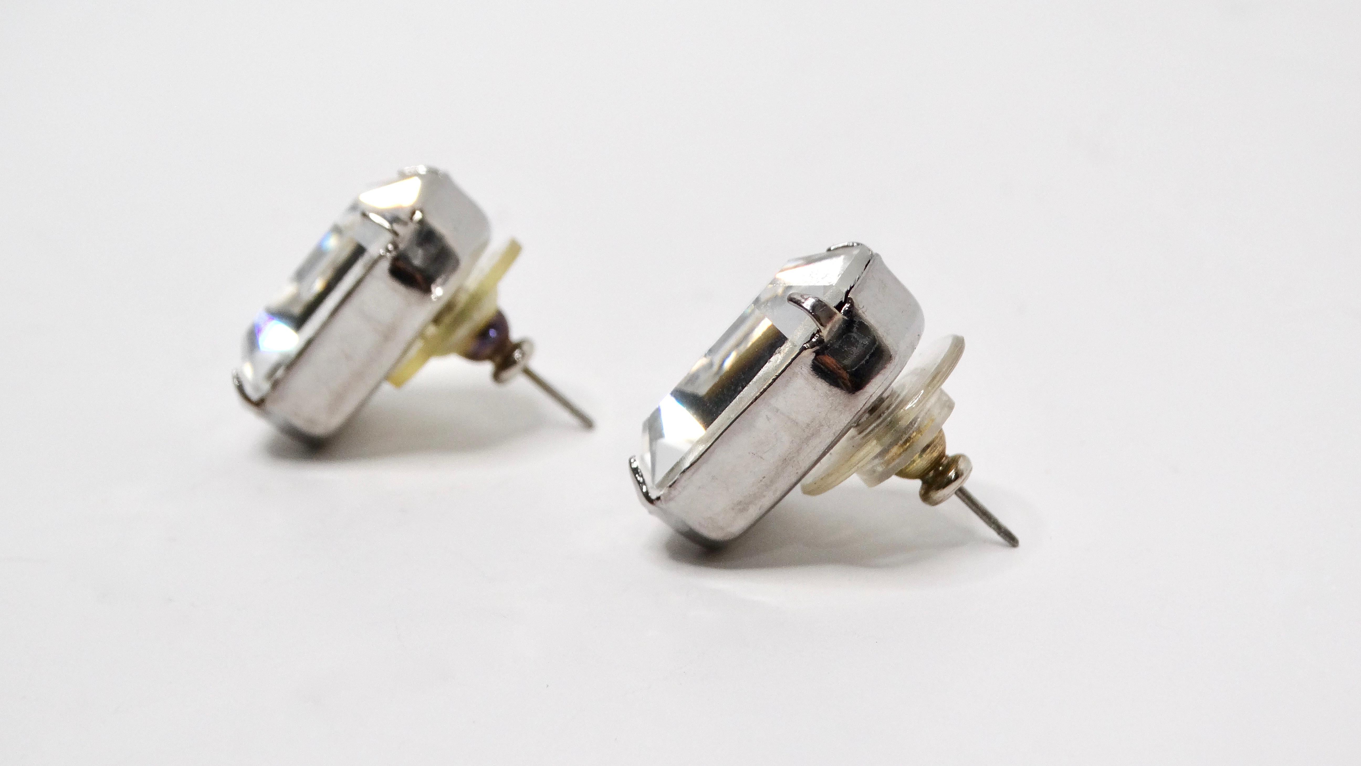 These Vintage Cartier Inspired Emerald Cut Style Rhinestone Earrings are the epitome of elegance and sophistication, crafted with a dazzling faux emerald cut rhinestone set in a lustrous sterling silver plating. Measuring 0.6 inches in length, these