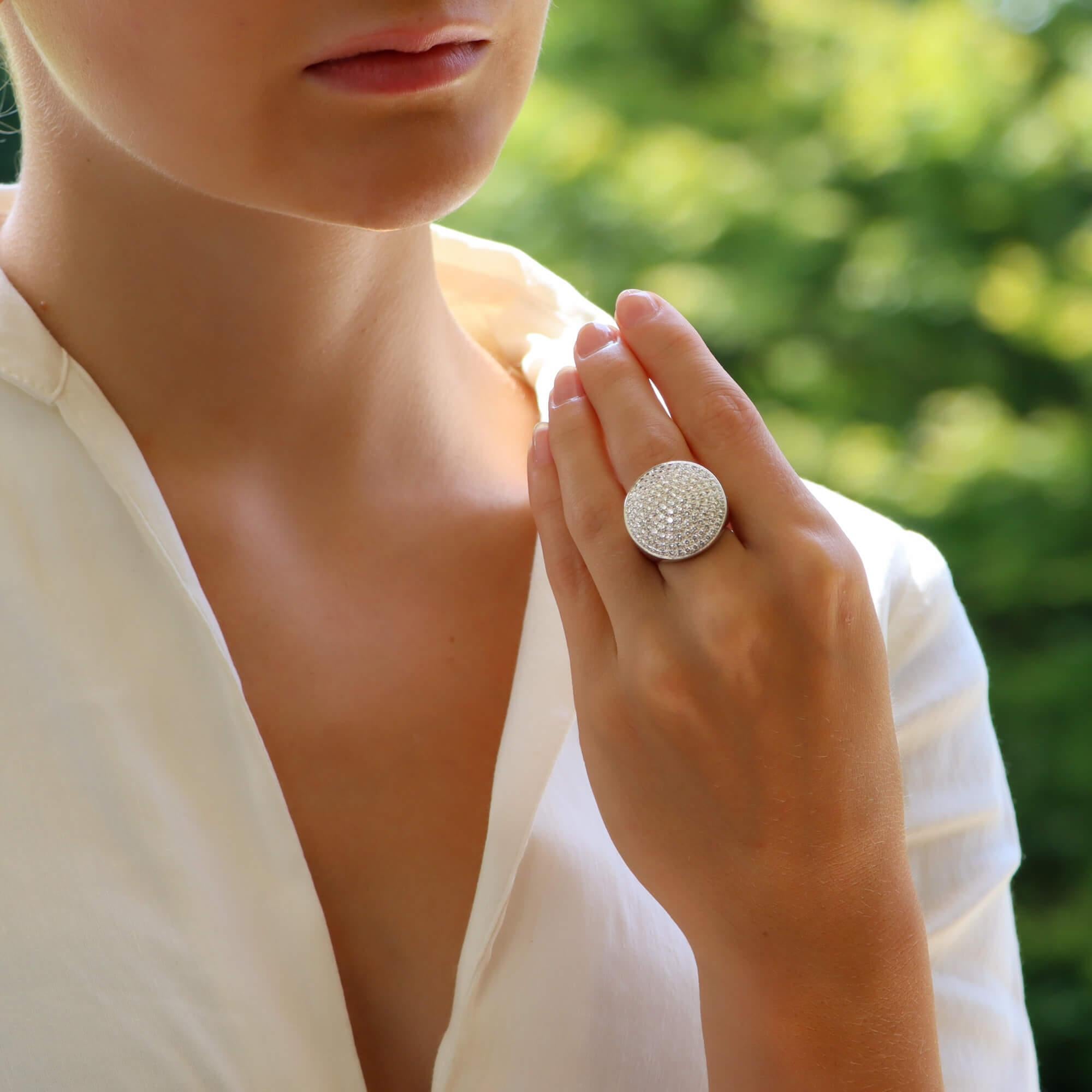 An extremely beautiful Cartier white diamond cocktail ring, from the Jeton Sauvage collection, set in 18k white gold.

This striking piece is pave set throughout with exactly 120 round brilliant cut diamonds which altogether creates this remarkable