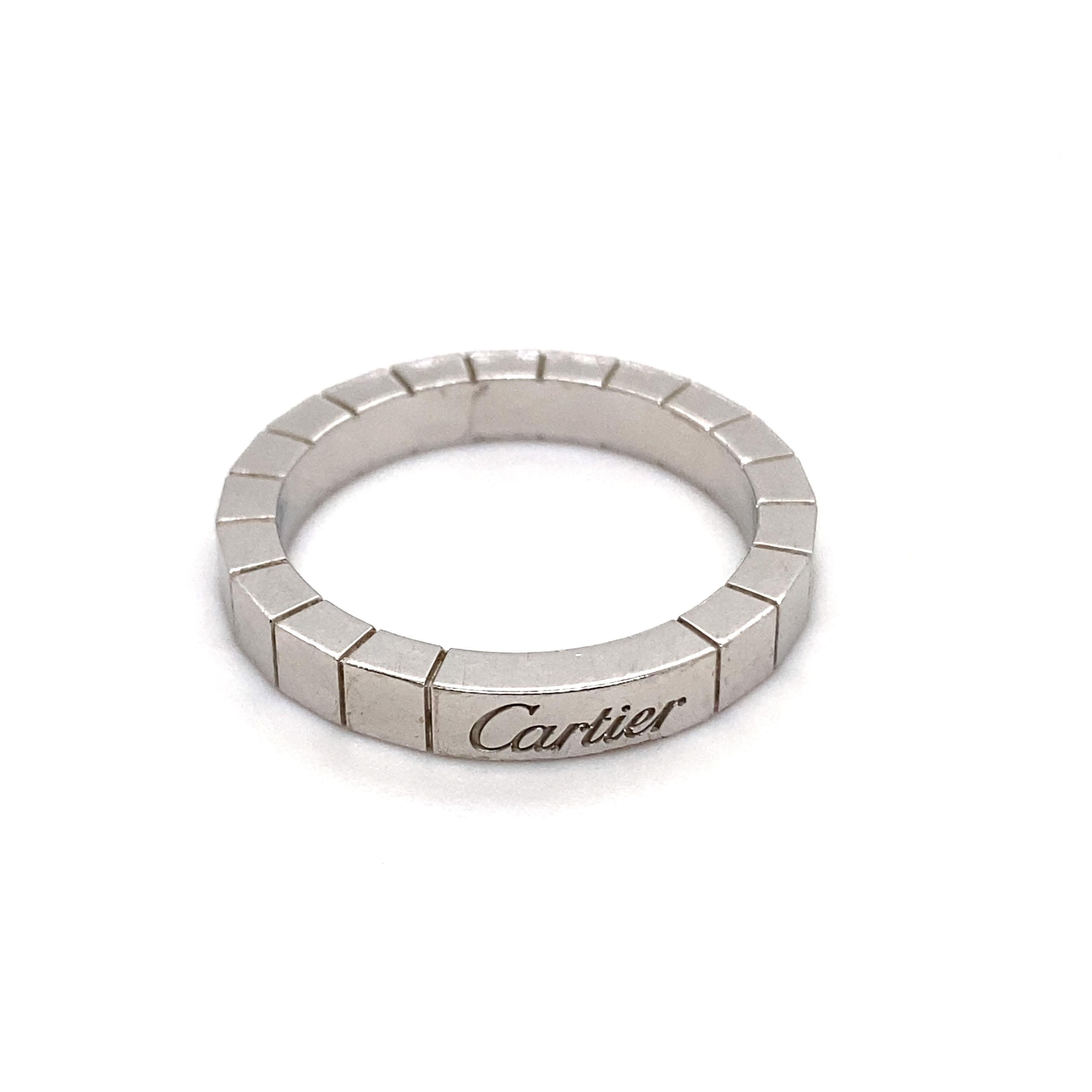 A vintage Cartier Lanières brick link band ring in 18 karat white gold, circa 2000.

The ring is comprised of Cartier's distinctive Lanières brick link design in 18 karat white gold.

The iconic Cartier signature is featured to the opposite side of