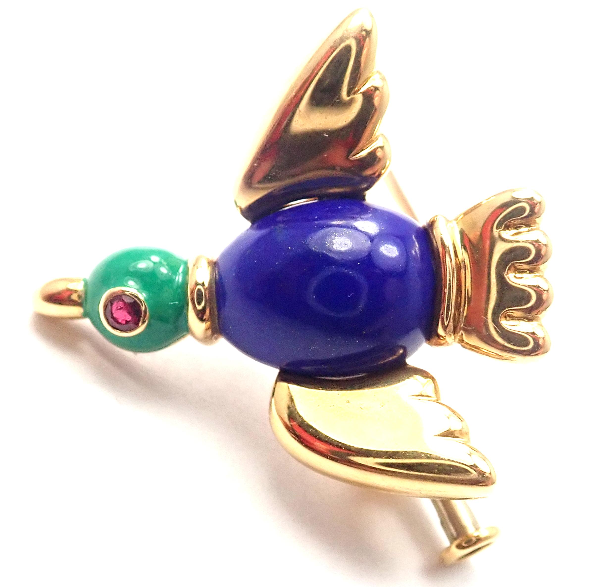 18k Yellow Gold Lapis Lazuli Ruby Brooch Pin by Cartier. 
With 1 lapis lazuli 10mm x 8mm
1 small ruby in the eye
Details: 
Measurements: 23mm x 22mm 
Weight: 6.8 grams 
Stamped Hallmarks: Cartier 750 1991 9XXXXX(serial number omitted)
*Free Shipping
