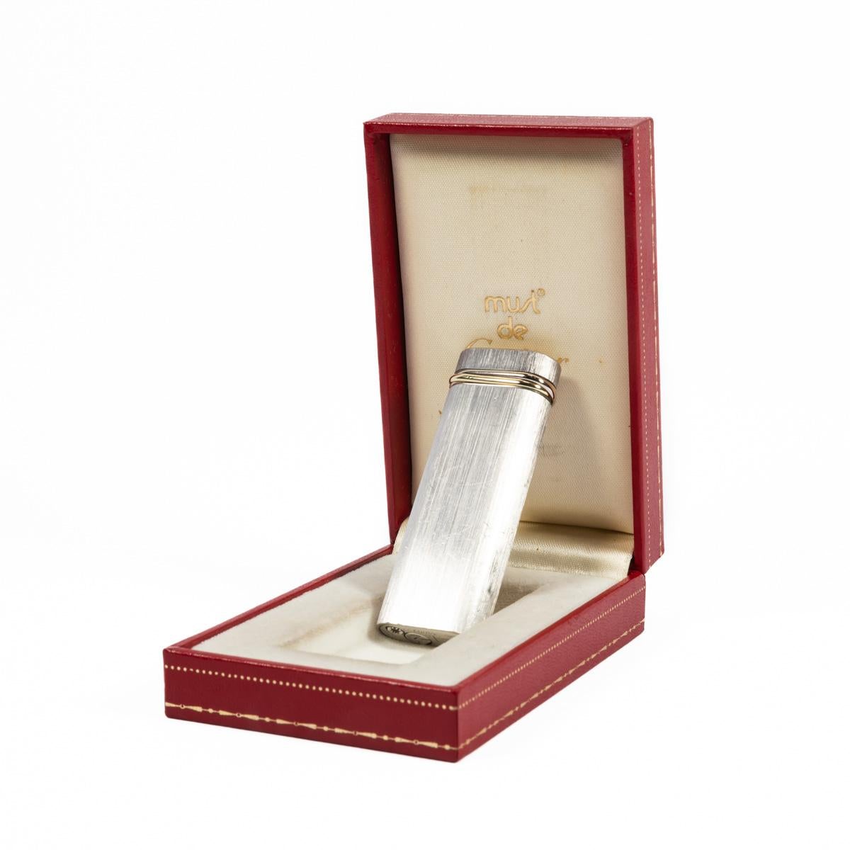 Vintage Silver Plated Cartier Les Must Trinity lighter

This brushed silver-plated Cartier Trinity lighter is indeed eye candy. Fully functional, sparks excellent, and lights every time. The spectacular and iconic Cartier black lacquer gives this