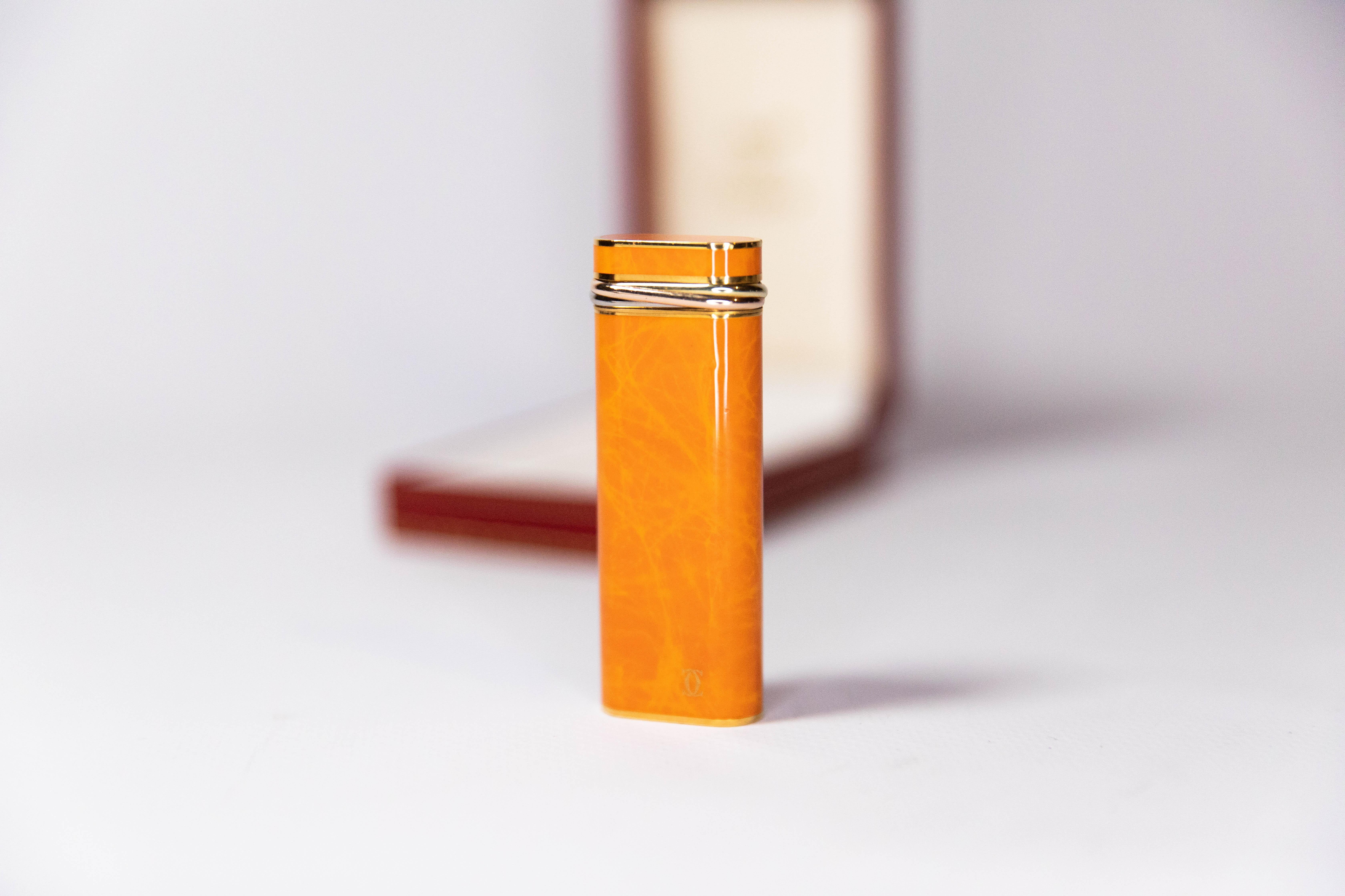 Vintage Orange Gold Plated Cartier Les Must Trinity lighter

This gold-plated Tortoiseshell lacquered Cartier Les must lighter is indeed eye candy. Fully functional, sparks excellent, and lights every time. The lighter is in absolutely magnificent
