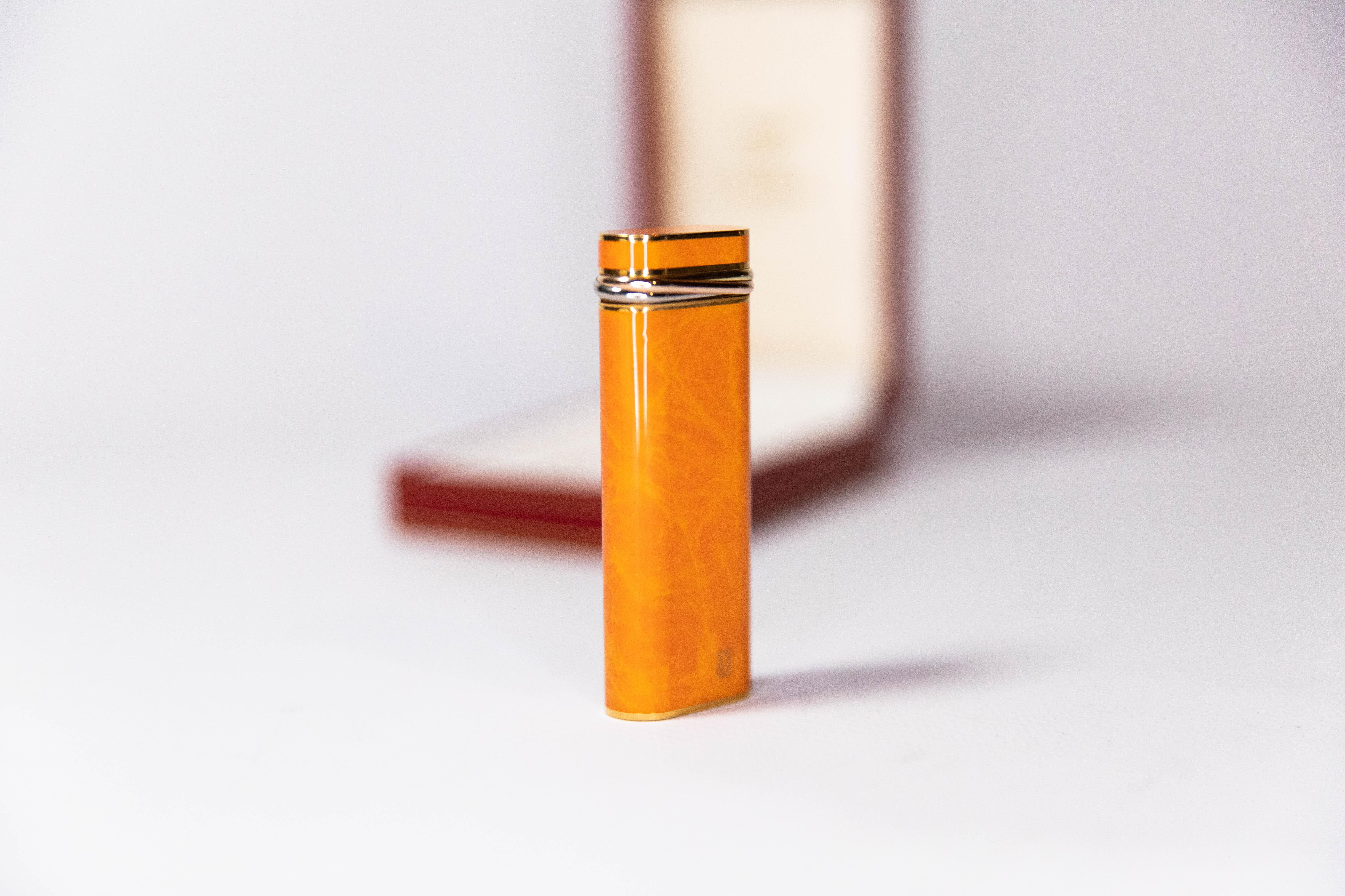 Vintage Cartier Les Must Trinity lighter Gold Plated with Orange Laquer For Sale 1