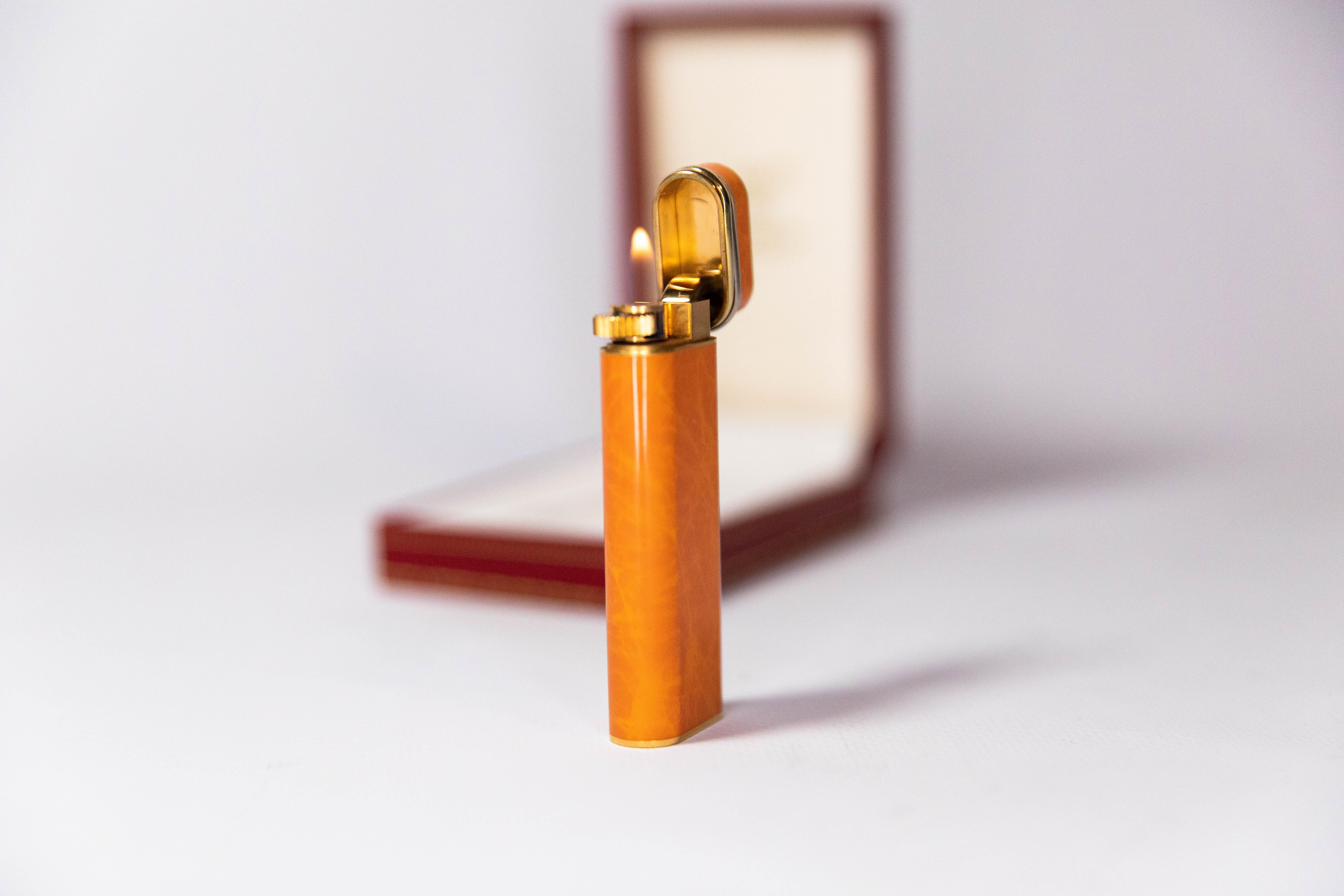 Women's or Men's Vintage Cartier Les Must Trinity lighter Gold Plated with Orange Laquer