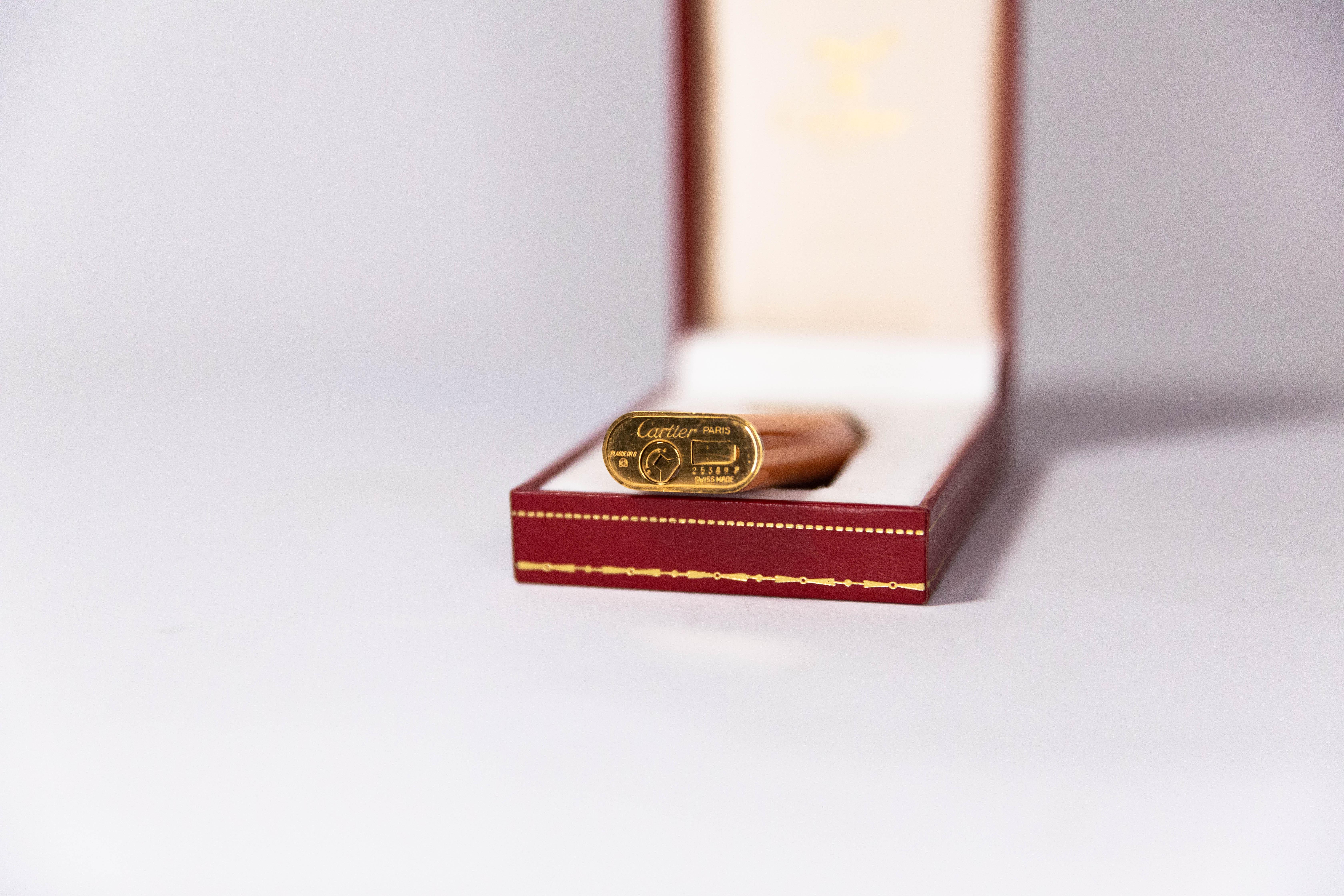 Vintage Cartier Les Must Trinity lighter Gold Plated with Orange Laquer 1