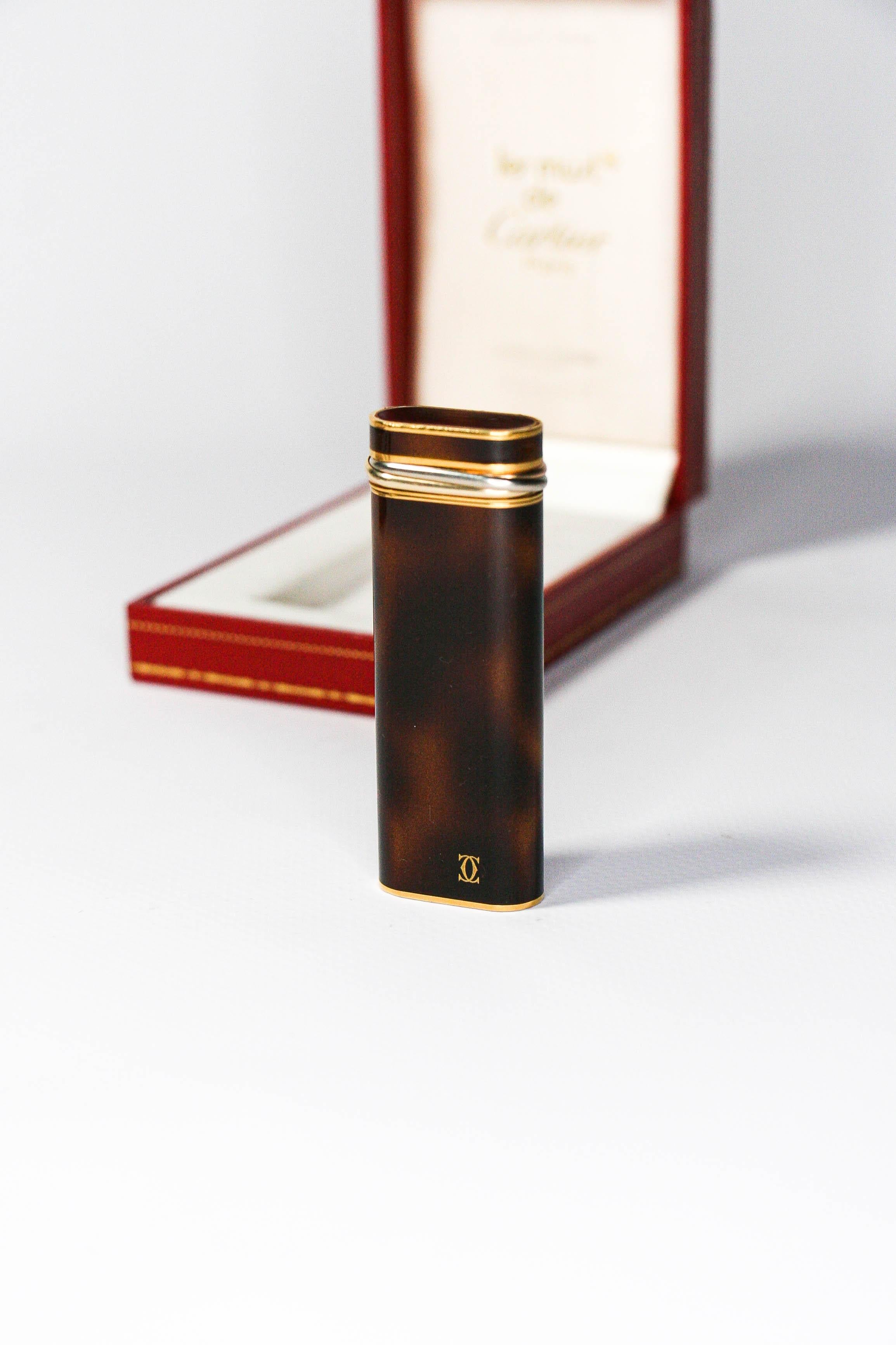 Vintage Tortoiseshell Gold Plated Cartier Les Must Trinity lighter

This gold-plated Tortoiseshell lacquered Cartier Les must lighter is indeed eye candy. Fully functional, sparks excellent, and lights every time. The lighter is in absolutely
