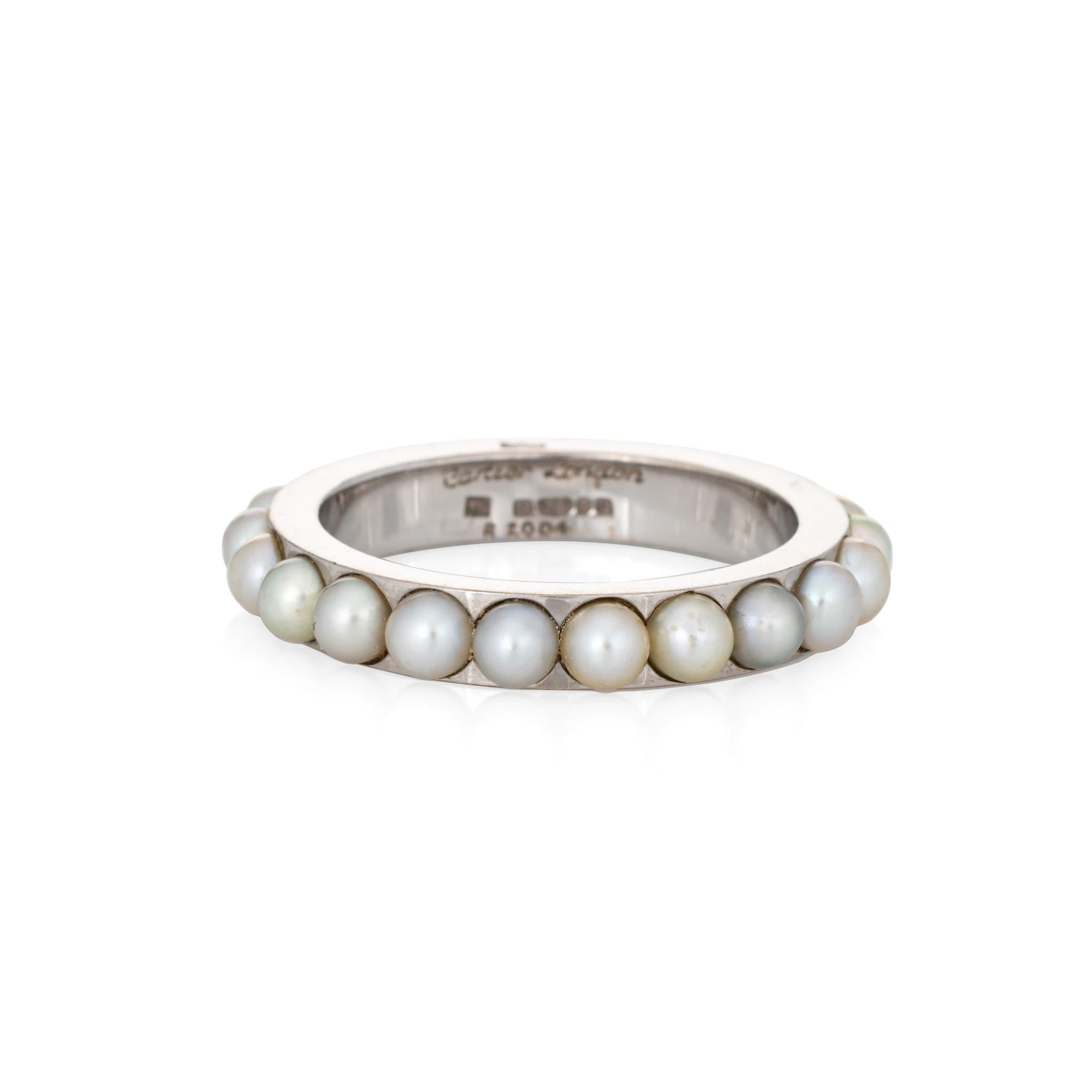 Vintage Cartier pearl eternity ring crafted in 18k white gold (circa 1979)

21 lustrous pearls measuring 3mm each are set into the band. The pearls are well matching, glossy, with soft rose overtones. Made by Cartier London in 1979 (the ring is