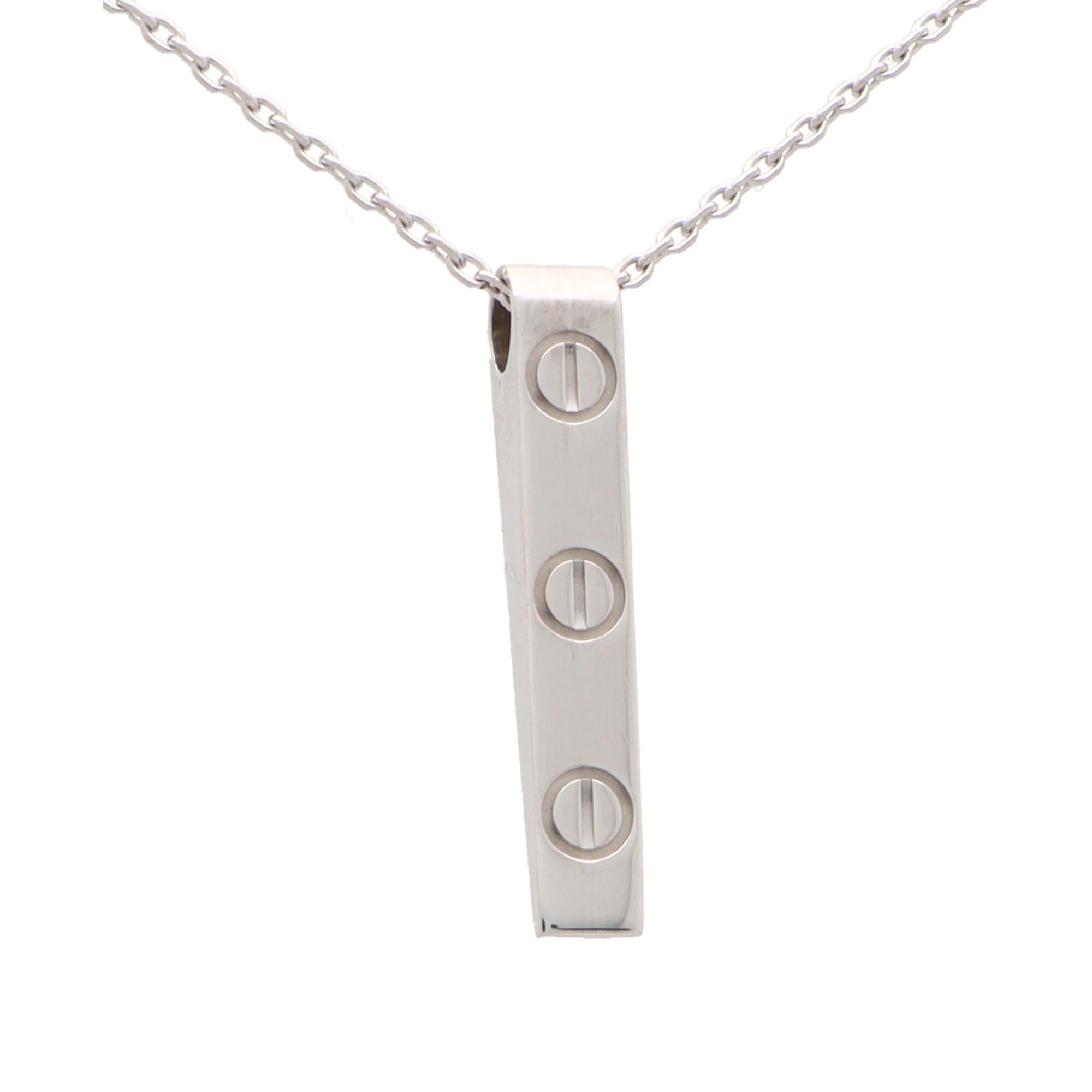 A unique vintage Cartier LOVE bar pendant set in 18k white gold. 

The pendant is formed in the iconic Cartier love motif, a collection that is a firm favourite of many. The bar is set with 3 nail motifs and hangs from a 16-18-inch white gold trace